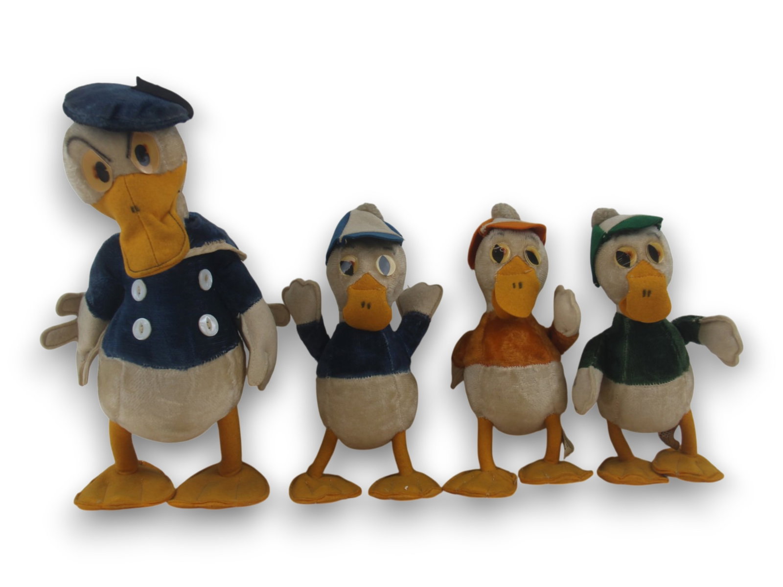 Character Novelty Company Set of Four Dolls: Includes Donald Duck 14" tall and Huey, Dewey and Louie each 8 1/2" tall with removable hats. Shipping: Weiss Auctions offers full-service, in-house shipping for nearly all items in this auction. For 