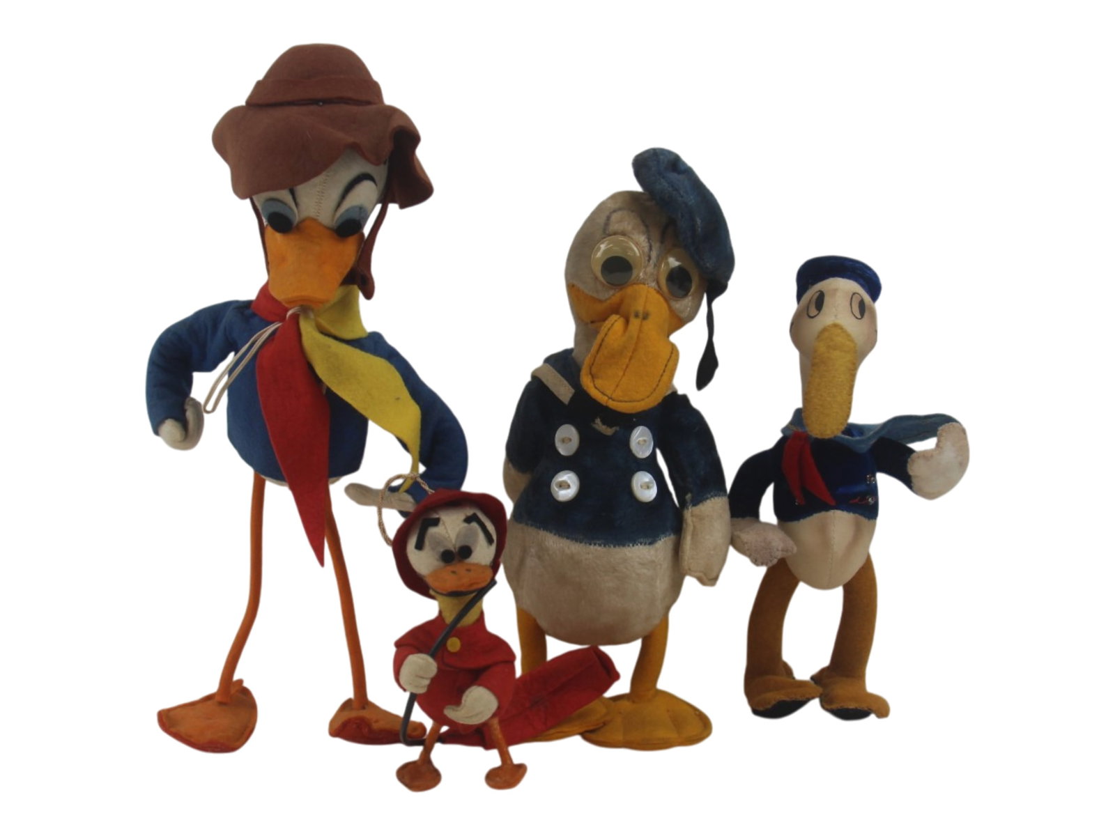 Vintage Donald Duck Doll Lot of (4): Lot includes 10" Character Novelty company doll, and three other felt dolls ranging in size from 4 1/2" - 11" includes a long billed Donald. Shipping: Weiss Auctions offers full-service, in-house ship