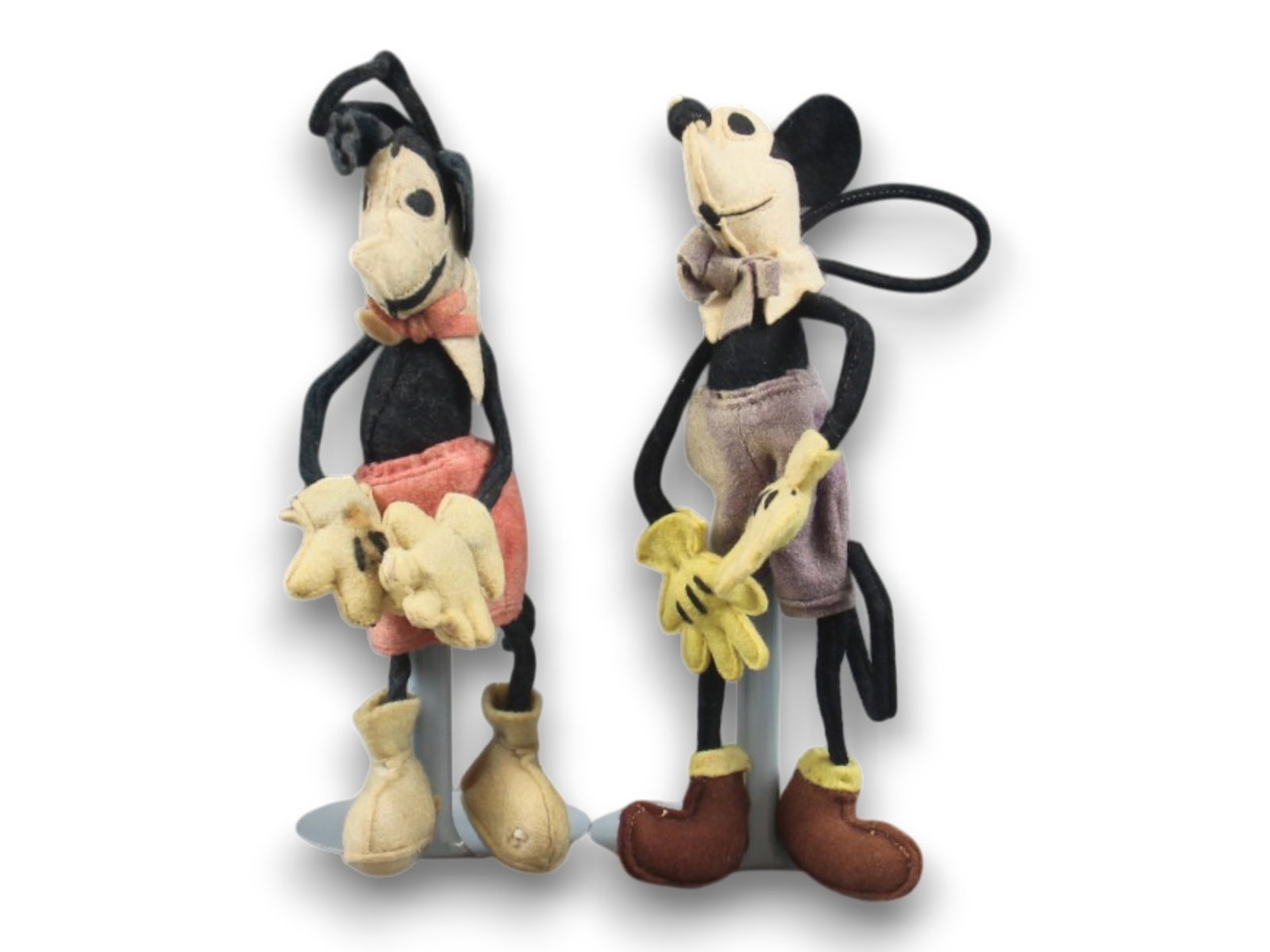 1930's Lenci Mickey Mouse Doll Pair: Pair of 1930's Lenci Mickey Mouse Dolls. Approx. 7 1/4'' tall each. Shipping: Weiss Auctions offers full-service, in-house shipping for nearly all items in this auction. For a shipping quote, please c