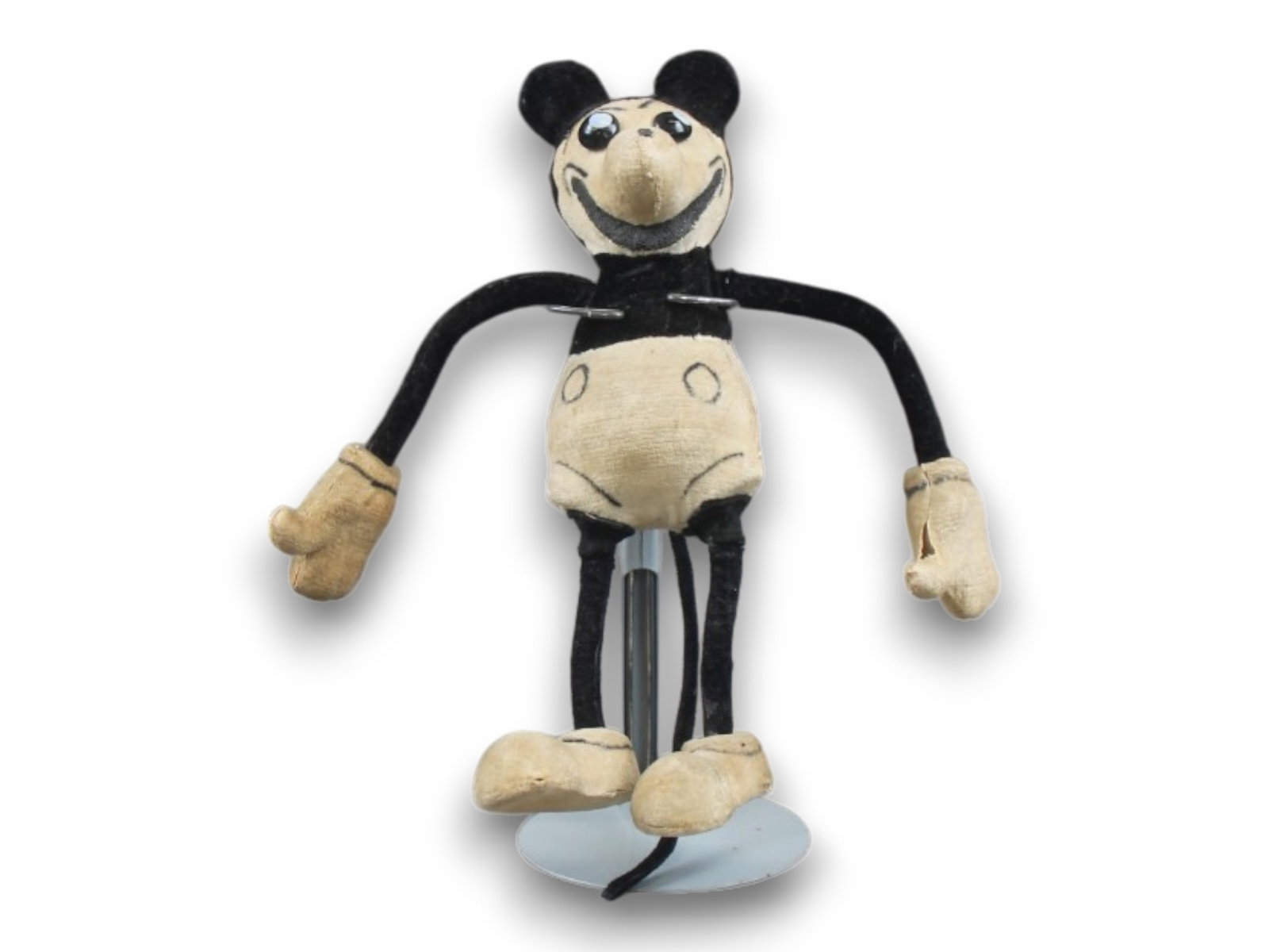 Rare 1930s German Velveteen Mickey Mouse Doll: Very rare 1930s German velveteen stuffed Mickey Mouse doll with glass eyes and wire frame.. Approx. 7 1/2'' tall. Shipping: Weiss Auctions offers full-service, in-house shipping for nearly all items i