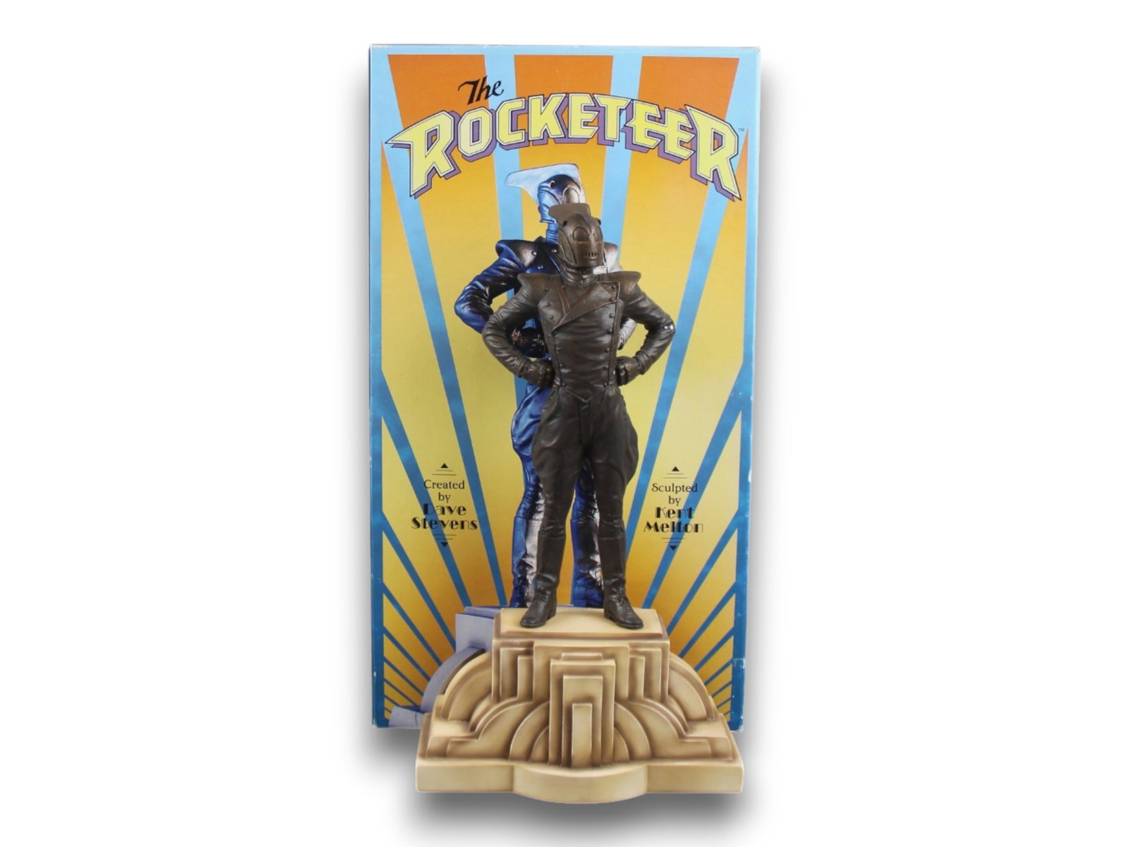 Randy Bowen Rocketeer Ltd Ed Statue w/Box: (Randy Bowen Designs, 1999) Created by Dave Stevens and sculpted by Kent Melton, hand painted cold cast bronze resin statue of "The Rocketeer". Measuring 14.5" tall. Back edge marked "The Rocketeer ? 