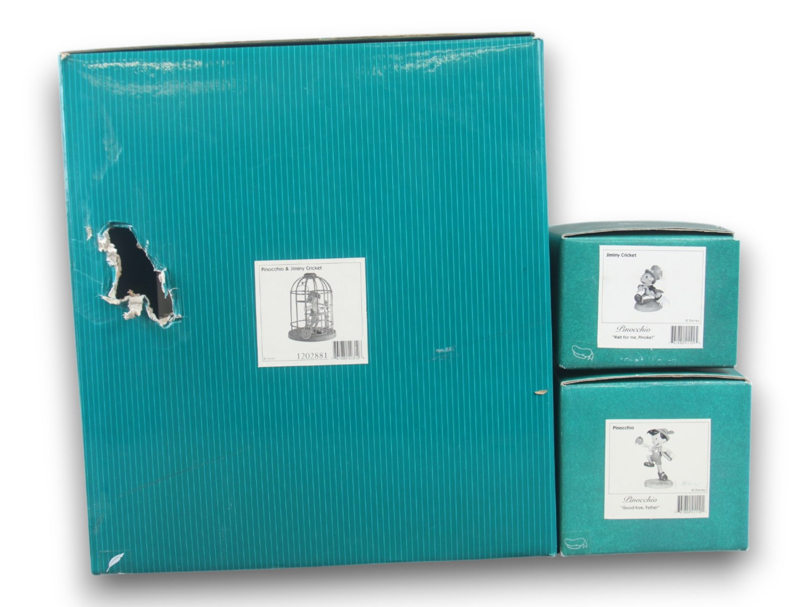WDCC Disney Classics, Pinocchio & Jiminy Cricket: (3 pieces) Includes Pinocchio, Jiminy Cricket, and Pinocchio/Jiminy Cricket - "I'll Never Lie Again". Each includes COA and each comes in the original box. Boxes show some edge/corner wear. The box