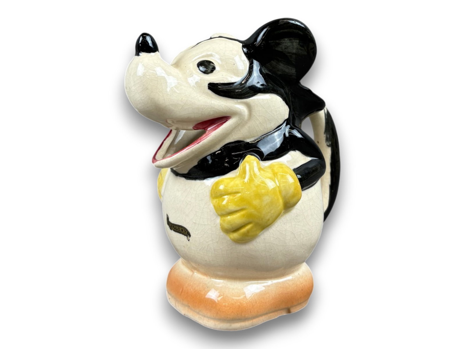 Disney. Mickey Mouse Pitcher Vintage: Japan circa 1930's 7" tall Buffalo NY label on chest. Shipping: Weiss Auctions offers full-service, in-house shipping for nearly all items in this auction. For a shipping quote, please contact us prio