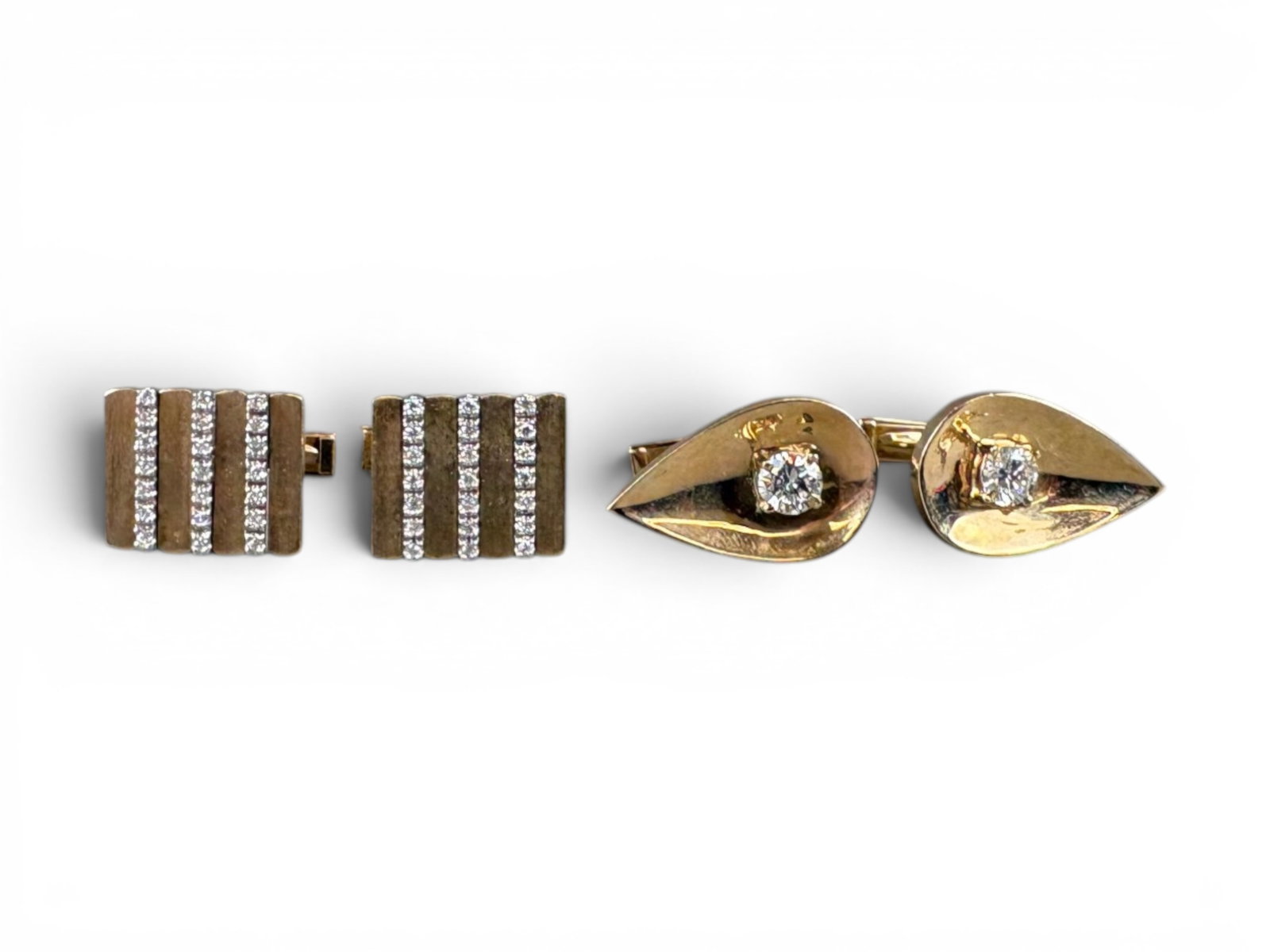 (2) Pairs 14K Gold Diamond Cufflinks: Group of two pairs of 14K gold cufflinks including (i) teardrop-shaped cufflinks set with round brilliant-cut diamonds having an approximate total weight of 1.00 carat, I color, slightly included 1