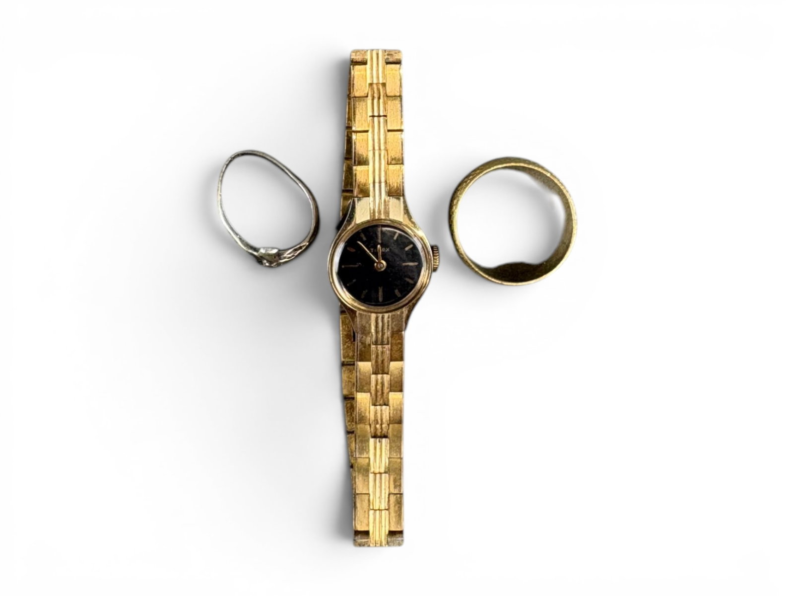 Estate Silver & Gold Jewelry Lot: Estate jewelry lot including a silver ring weighing 2.0 grams, an 18 karat yellow gold ring weighing 8.5 grams, and a wristwatch. Offered on behalf of the New York County Public Administrator's