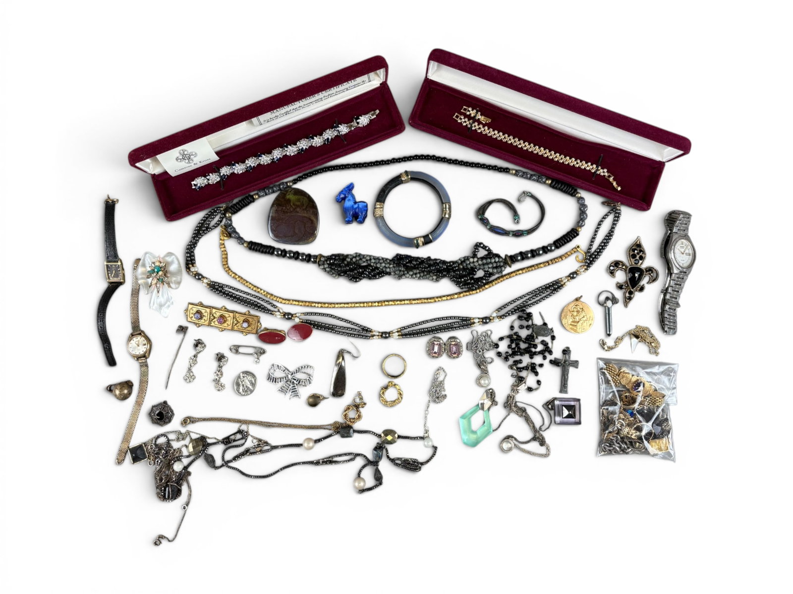 Estate Silver & Gold Jewelry Group: Estate jewelry lot including costume jewelry, watches, silver jewelry weighing 83 grams, 14 karat gold jewelry weighing 45.6 grams, and a 2.5 gram 24 karat gold bar in an 18 karat frame. Offered on