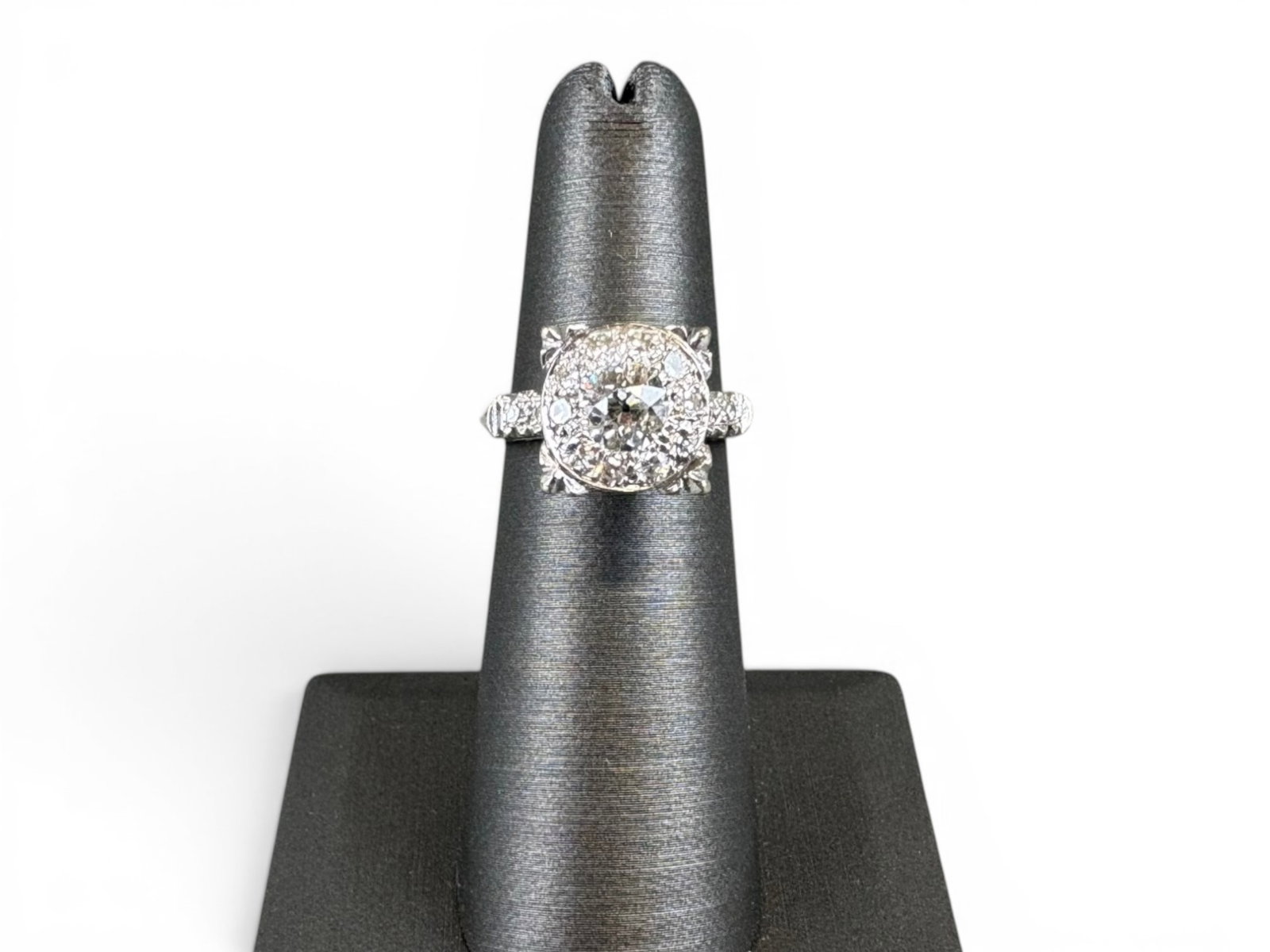 14K Gold Old European Diamond Ring: 14K white gold ring centered by a natural old European-cut diamond measuring approximately 5.70 x 3.60 millimeters, estimated weight 0.75 carat, J color, slightly included 1 clarity. Further set with 