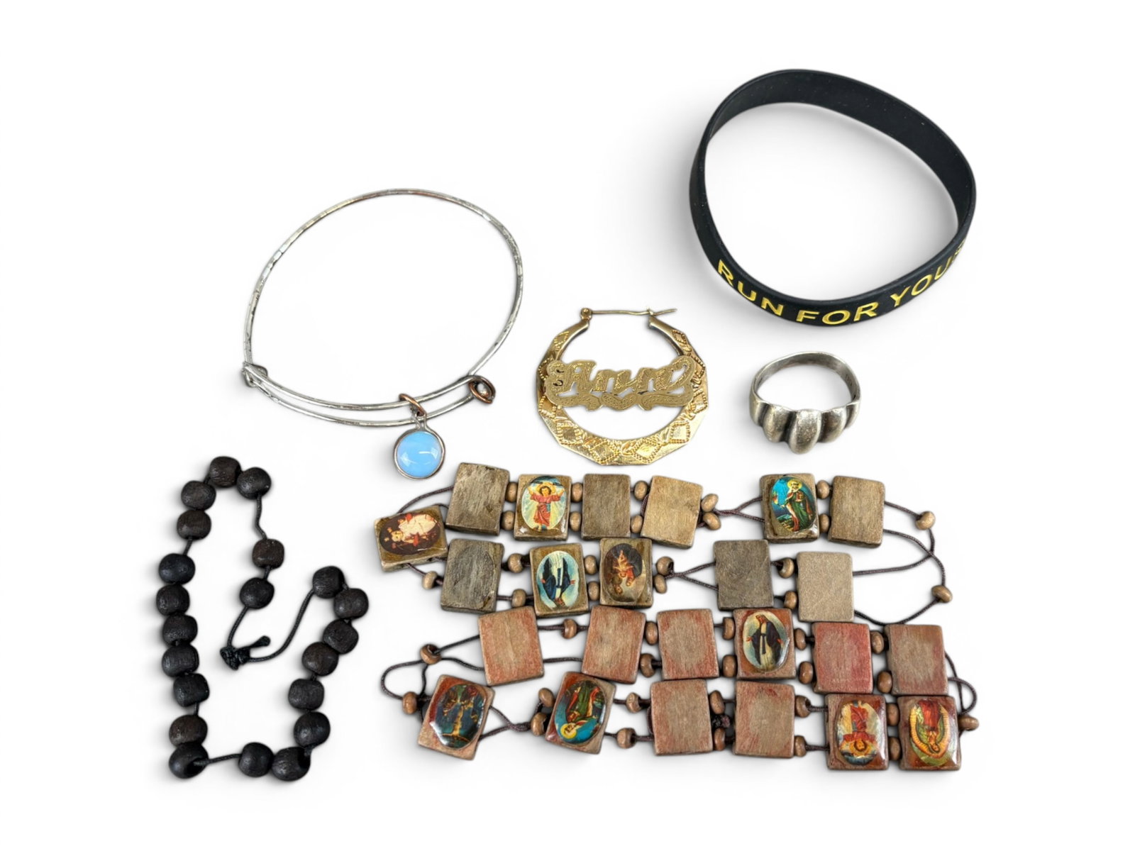 Estate Silver & Gold Jewelry Lot: Estate jewelry lot including costume jewelry, silver ring weighing 5.8 grams, and a 14 karat gold earring weighing 3.8 grams. Offered on behalf of the New York County Public Administrator's Office fro