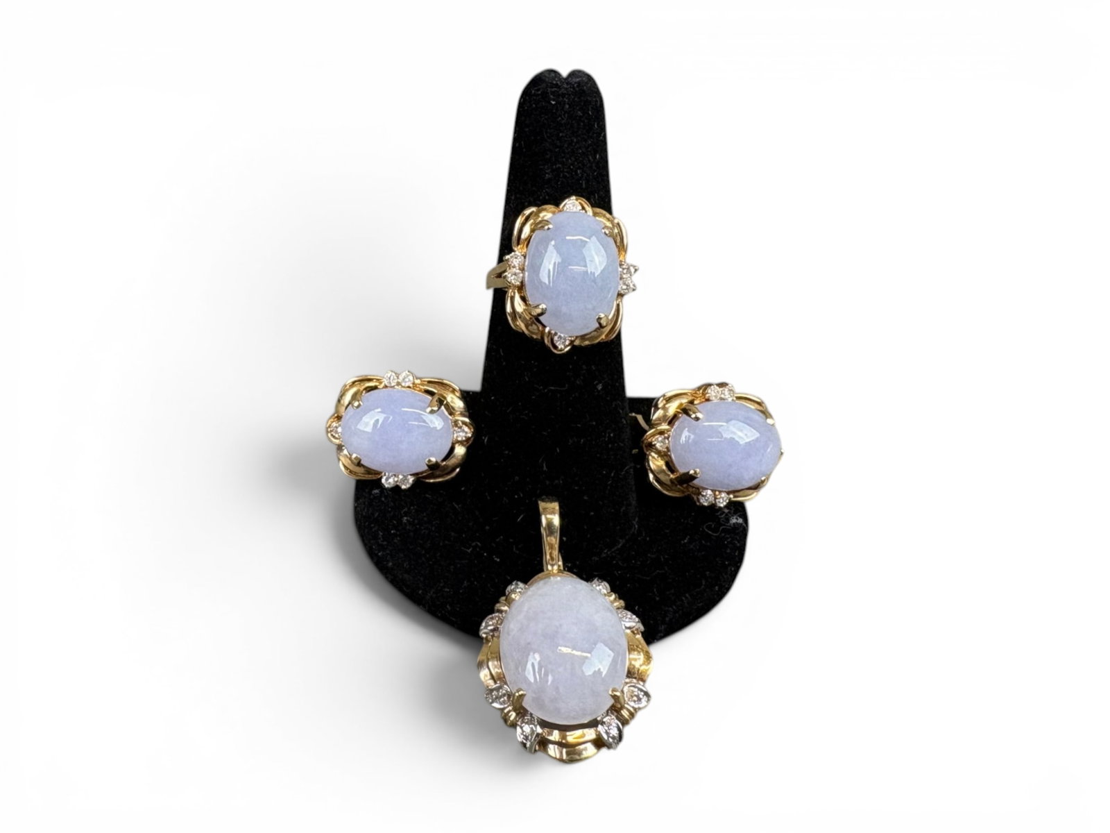 14K Gold Lavender Jade Jewelry Set: 14K yellow gold jewelry set with natural lavender jade, including earrings, ring, and pendant, each with small diamond accents at the sides. Pendant measures approximately 16.8 x 14.0 millimeters. Rin