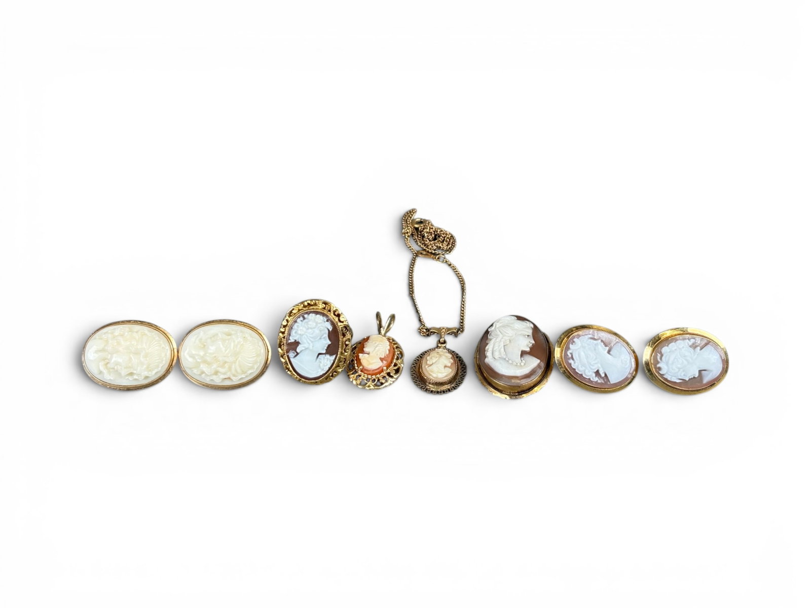 Estate Cameo Collection in Gold Frames: Estate cameo collection in 14K and 18K gold frames, comprising 8 pieces including ring, earrings, brooch, and necklace (chain is marked gold filled). Nice vintage collection. Shipping: Weiss Auctions 