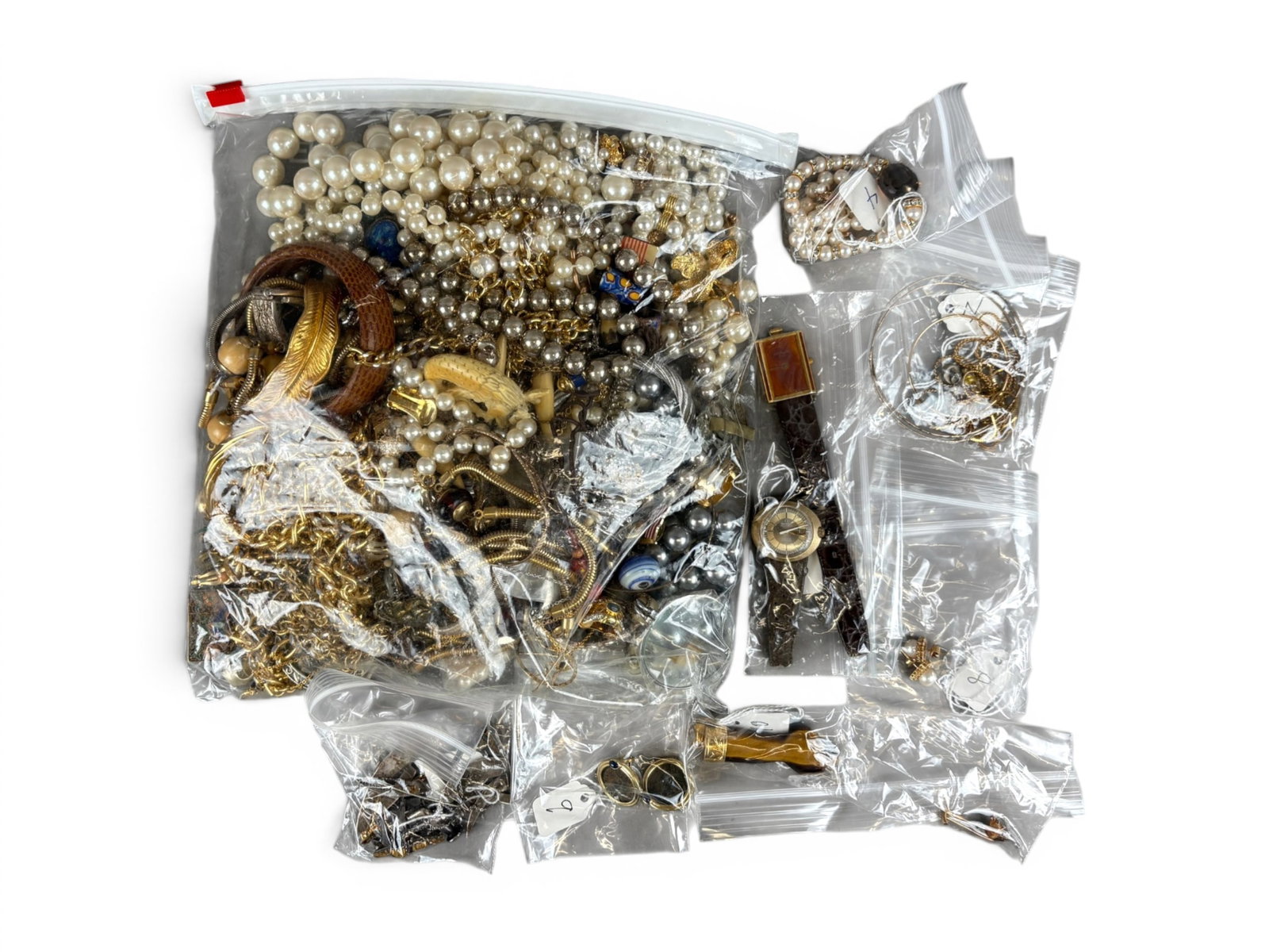 Estate Jewelry, Watches & Coin Group: Estate lot including Akoya pearls, Omega and DuPont watches, gold jewelry, and ancient coin earrings. Offered on behalf of the New York County Public Administrator's Office from the estate of Keiko Oh