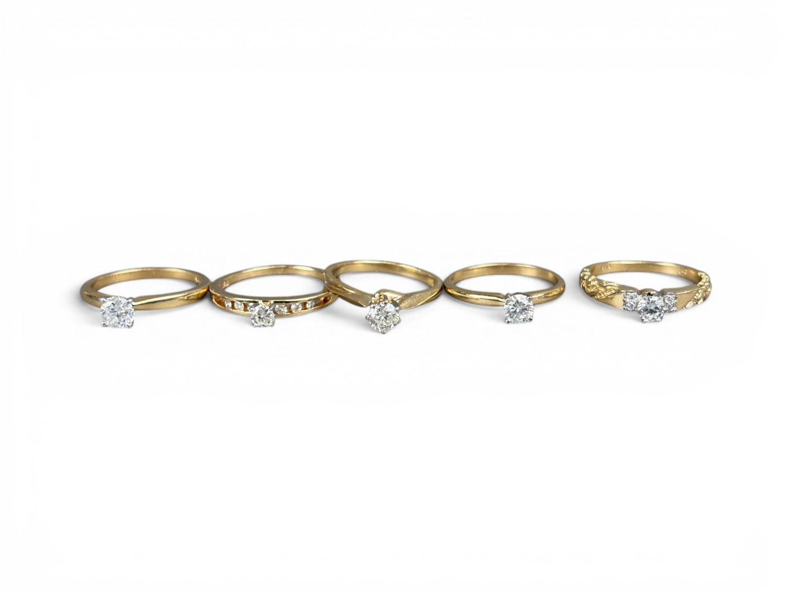 (5) Estate Gold Diamond Rings: Estate group of five gold rings including (i) a 14K yellow gold round brilliant-cut diamond engagement ring with center diamond weighing approximately 0.15 carat and shoulder diamonds totaling approxi