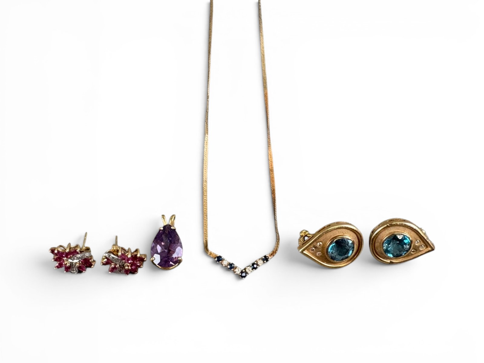 Estate Gold Jewelry Group: Estate gold jewelry group including (i) a 14K gold amethyst pendant, total weight approximately 2.1 grams; (ii) a pair of 14K gold blue topaz earrings, total weight approximately 10.7 grams; (iii) a p