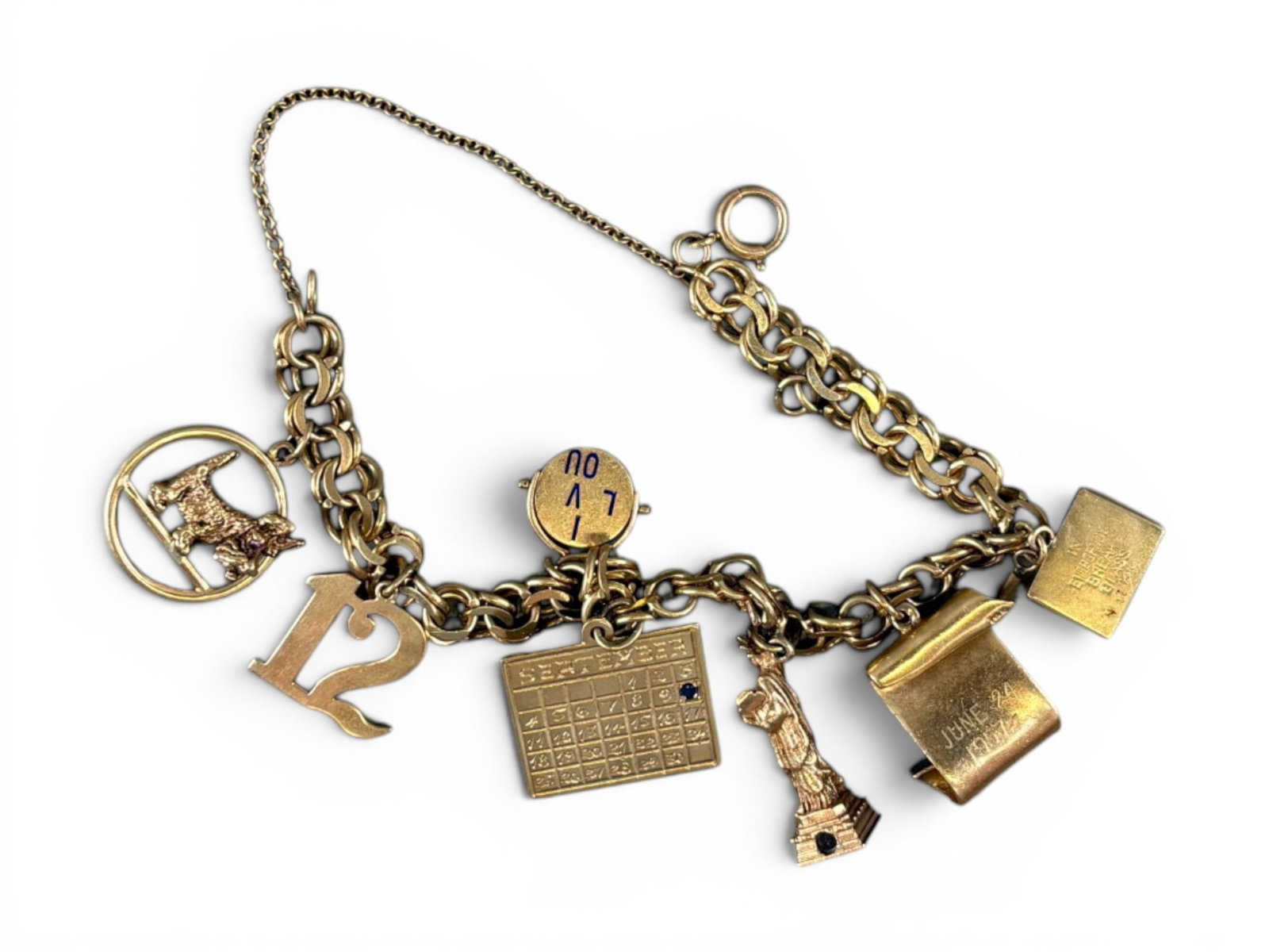 14K Gold Charm Bracelet: 14K yellow gold charm bracelet weighing approximately 41.7 grams. Offered on behalf of the New York County Public Administrator, Estate of Rosemary Gaffney, Estate No. 250009. Shipping: Weiss Auctions