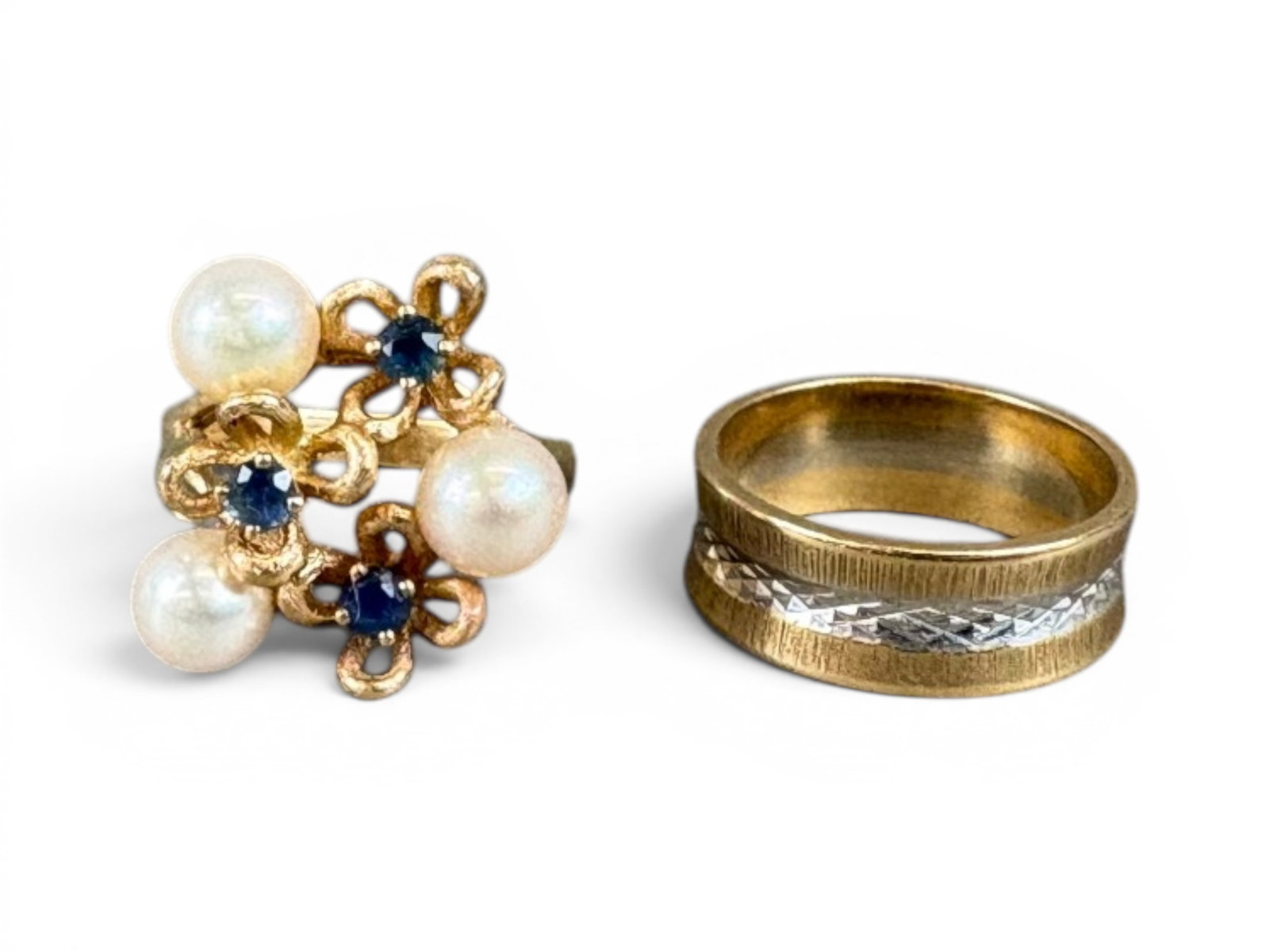 (2) 14K Gold Rings: Group of two 14K gold rings including (i) a 14K yellow gold cultured pearl and sapphire ring set with pearls measuring approximately 6.5 millimeters and sapphires having an approximate total weight of