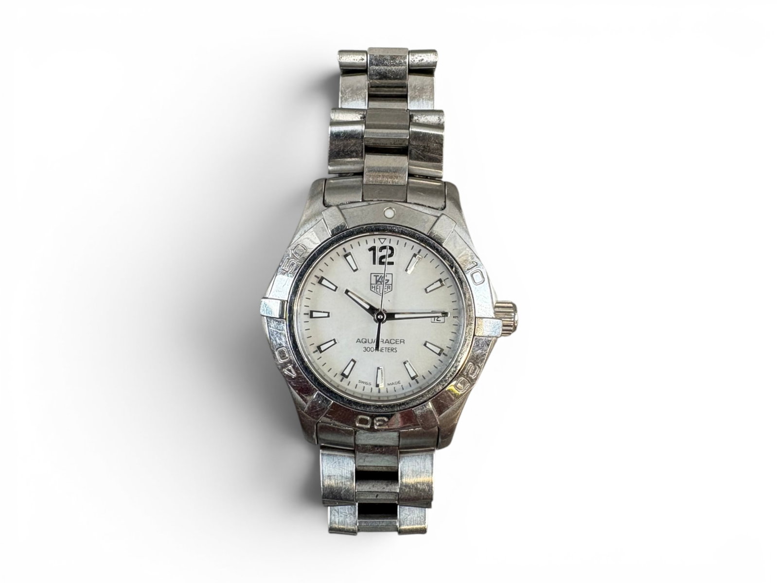 TAG Heuer Aquaracer Ladies Watch: Ladies stainless steel TAG Heuer Aquaracer wristwatch with mother-of-pearl dial. Shipping: Weiss Auctions offers full-service, in-house shipping for nearly all items in this auction. For a shipping