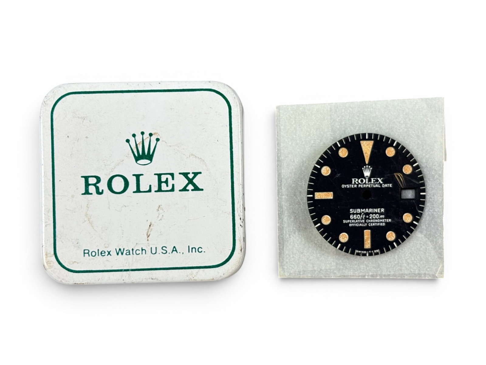 Rolex Factory 5512 Submariner Dial: Factory original Rolex 5512 Submariner dial, circa 1960s, marked 600ft/200mm with radium plots (not glowing). Includes factory tin and glassine bag. Shipping: Weiss Auctions offers full-service, in-ho