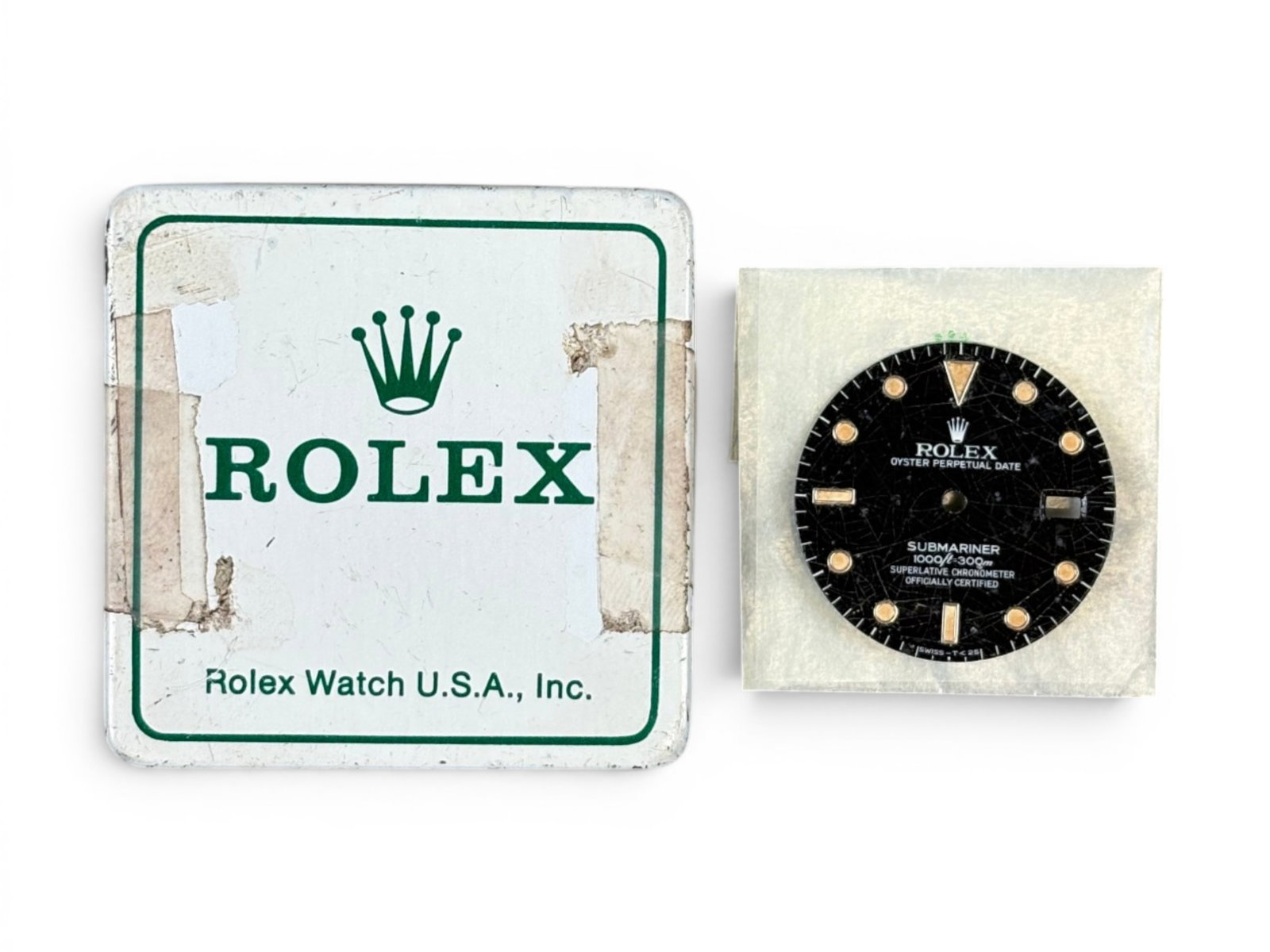Rolex Factory 16800 Submariner Dial: Factory original Rolex Submariner 16800 dial, circa 1980, marked 1000ft/300m, glossy with radium plots (not glowing). Rare tropical spider dial. Includes factory tin and glassine bag. Shipping: Weiss 