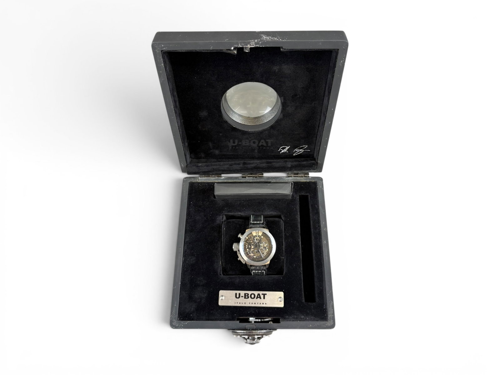 Watch. U-Boat Titanium Tungsten Boxed: Limited Edition #69/299 Chronograph Watch with see through dial to see inner workings. Box is complete and includes U Boat silk. Box is a bit rough. Shipping: Weiss Auctions offers full-service,
