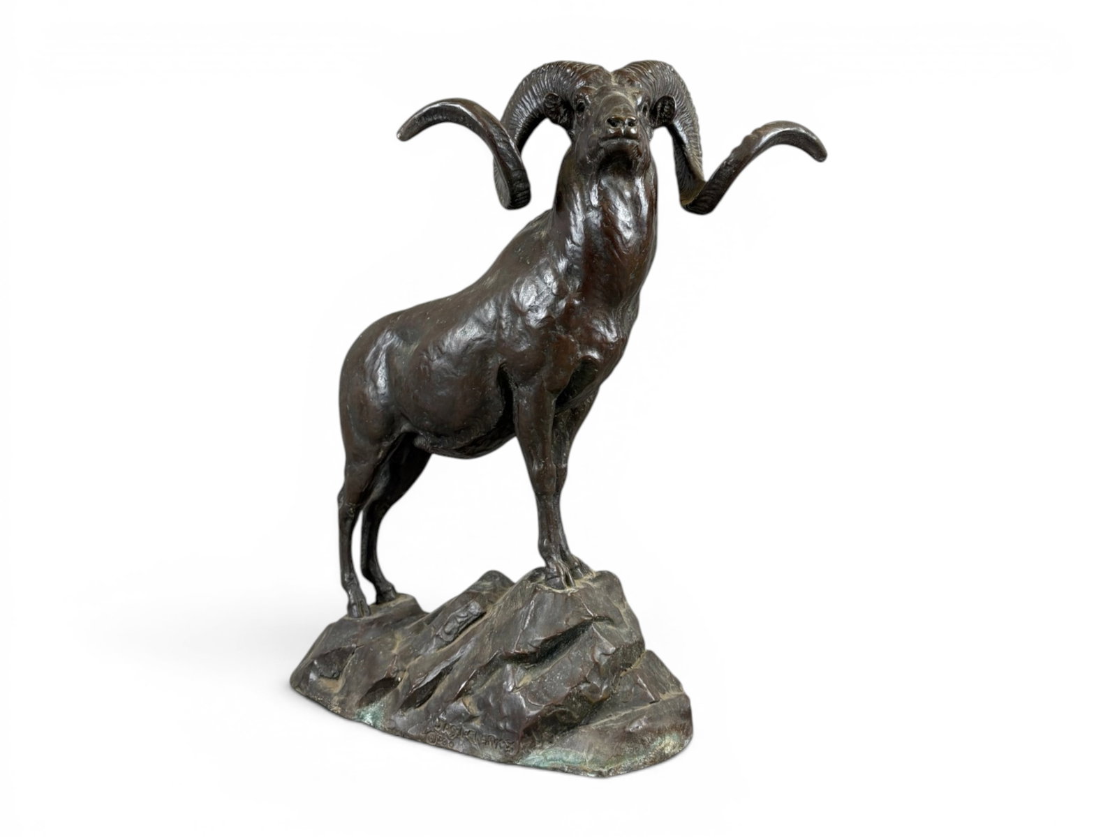 James Lippitt Clark Bronze Ovis Poli Ram Sculpture: Bronze sculpture by noted American wildlife artist James Lippitt Clark (1883-1957) depicting an Ovis Poli (Marco Polo) ram standing alert atop a rocky mountain. The ram is rendered with sweeping