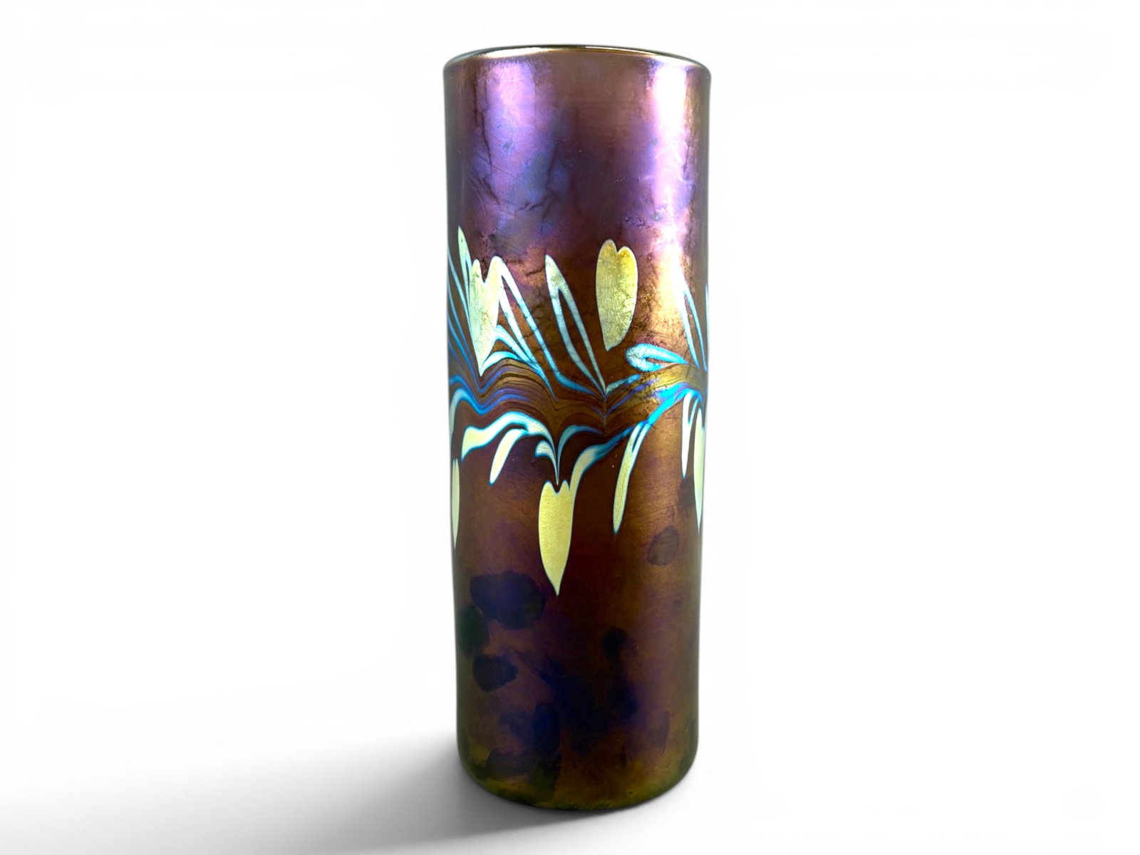 Correia Art Glass Iridescent Vase: Correia Art Glass cylindrical studio vase with deep iridescent purple. Etched signature along the bottom edge. Approx. 10-1/4" x 3-3/4". Light surface wear consistent with handling. Shipping: Weiss Au
