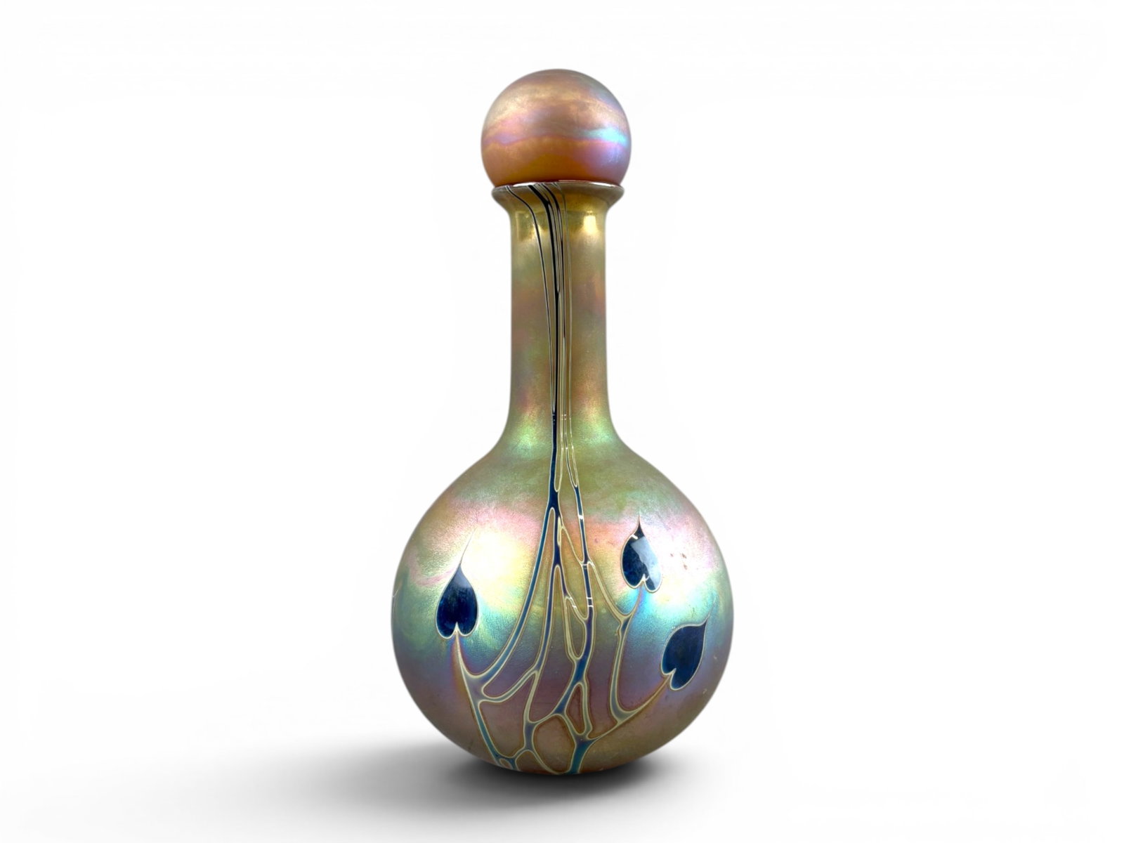Craig Zweifel Art Glass Decanter w/Stopper: Craig Zweifel art glass decanter with stopper, featuring an iridescent satin finish with pulled feather-style decoration and cobalt blue teardrop accents. Formed with bulbous body, elongated neck,