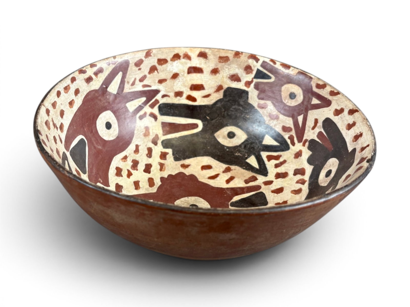 Pre-Columbian Dog Decorated Bowl: Pre-Columbian bowl with dog decorations, measuring approximately 7 3/8 inches across at rim and 3 inches tall. Ex-Sotheby's sale 6946, lot 4. Shipping: Weiss Auctions offers full-service, in-house
