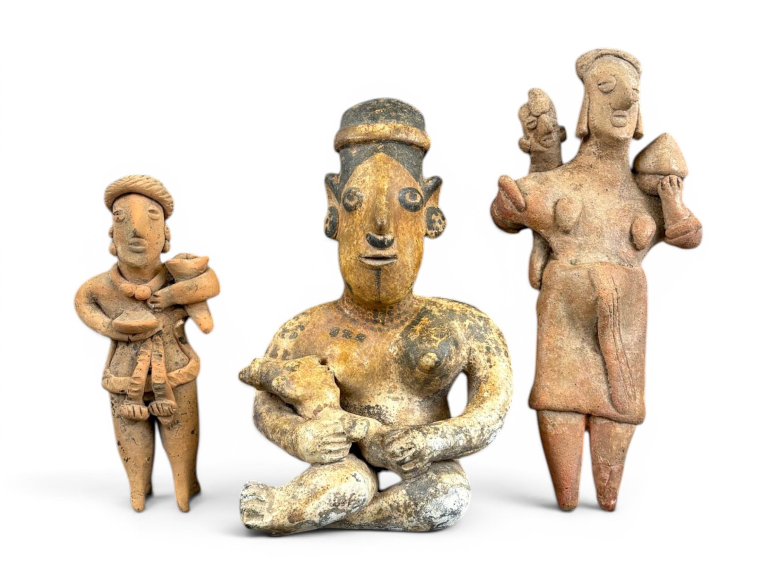 (2) Pre-Columbian Pottery Figures Incl. With Dog: Two Pre-Columbian pottery figures of women, one holding a dog. Ex-Sotheby's lot 205 (sale number identification label missing). Measure approximately 7 inches and 8 1/2 inches tall, respectively.