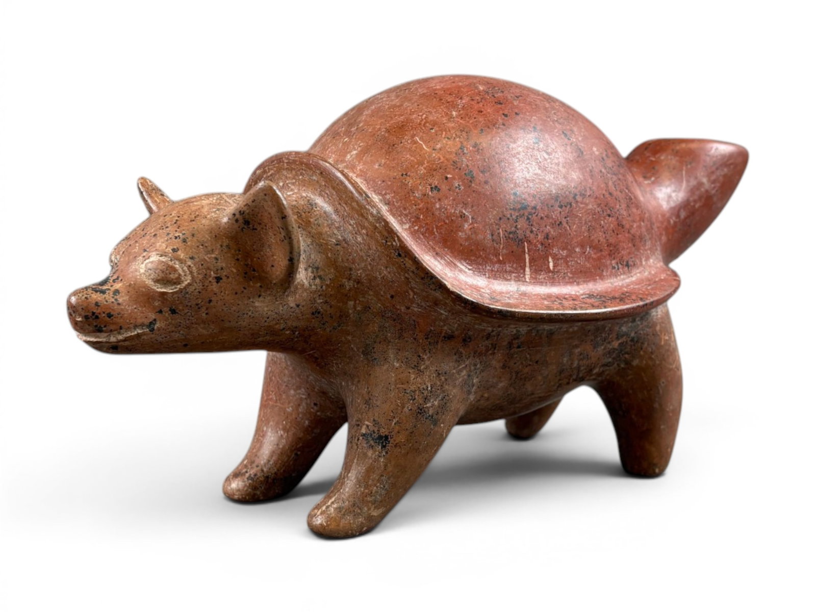Pre Columbian Armadillo Vessel: 12" long The Armadillo is red with a smooth shell. Shipping: Weiss Auctions offers full-service, in-house shipping for nearly all items in this auction. For a shipping quote, please contact us prior