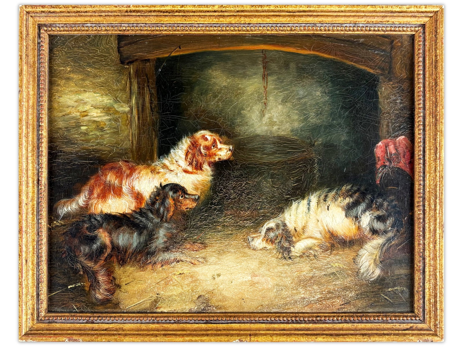 19th Century Oil Painting of Terriers, Unsigned: 19th century unsigned oil on board depicting three terriers in a rustic interior setting, gathered around a hearth or kettle with warm light illuminating the scene. Nicely detailed composition in the