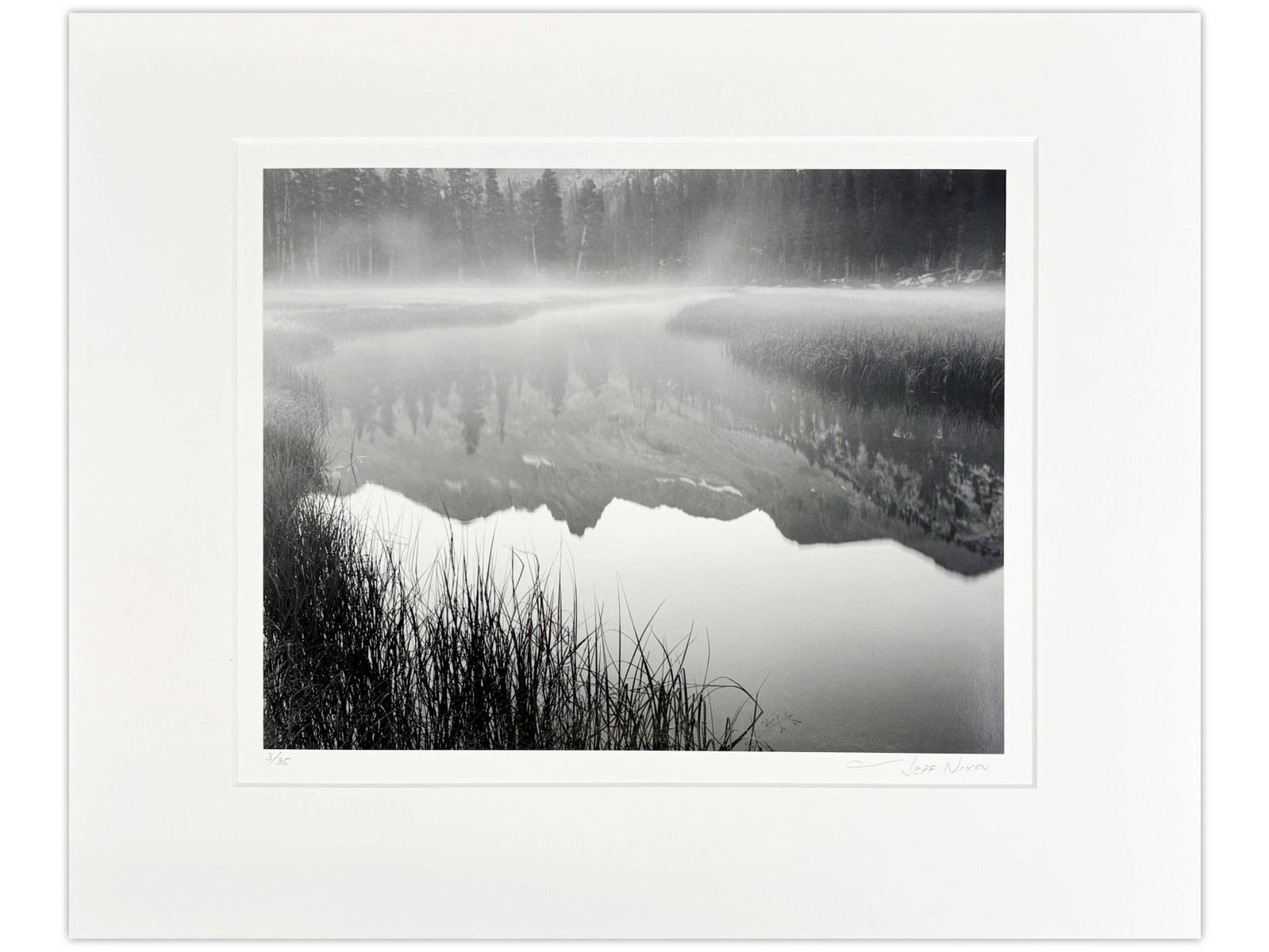 Jeff Nixon Signed Photo, "Morning Mist": Jeff Nixon (American, 1952-2022). Limited edition unframed gelatin silver print, "Reflection of Mount Ansel Adams, Morning Mist". Pencil signed lower right under image, and pencil numbered 3/35 lower 