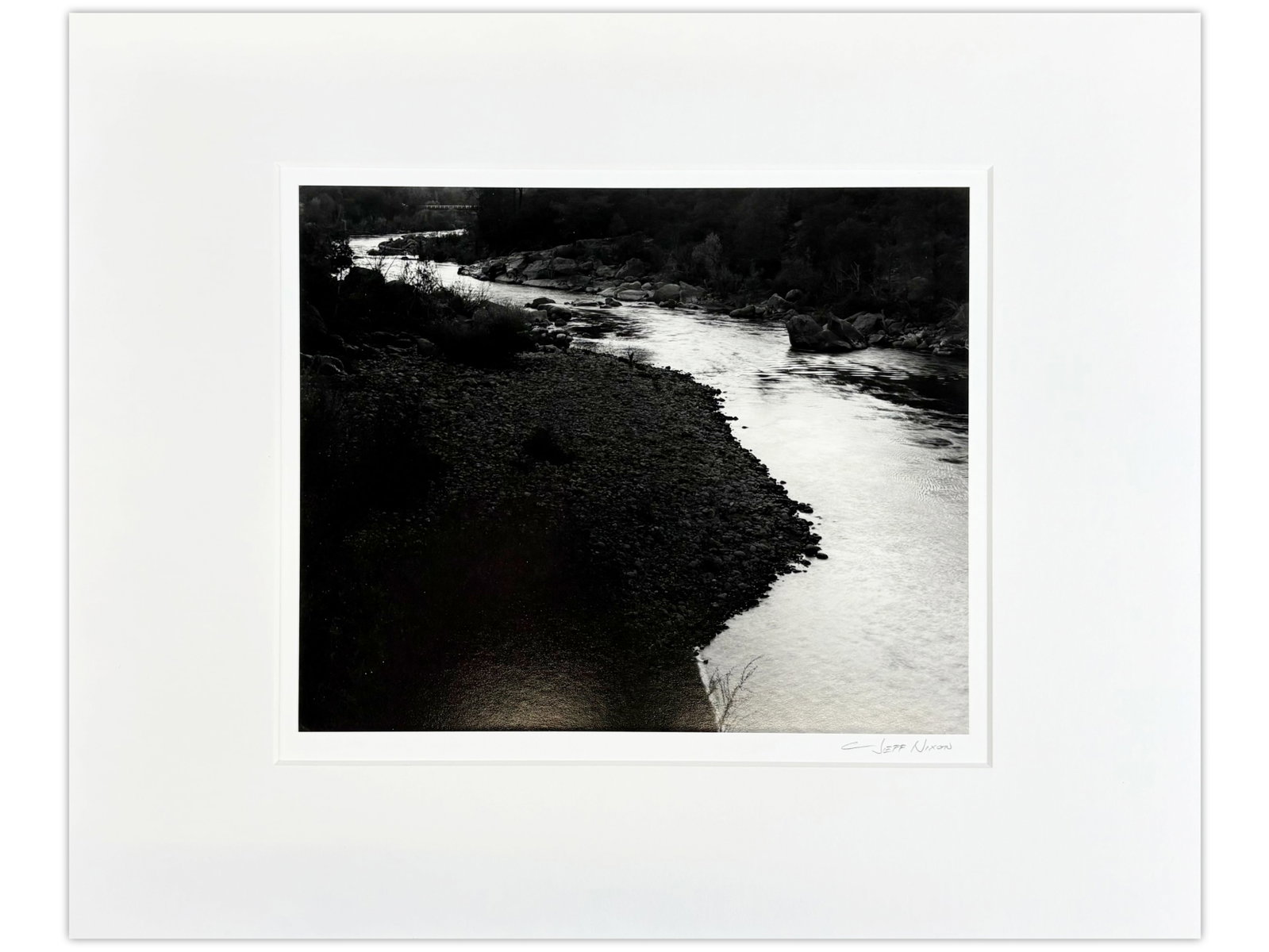 Jeff Nixon Signed Photo, "Stanislaus River": Jeff Nixon (American, 1952-2022). Unframed gelatin silver print, "Early Evening, Above Parrott's Ferry, Stanislaus River". Pencil signed lower right under image. Sight seen approx. 9-1/2" x 7-1/2". Pr