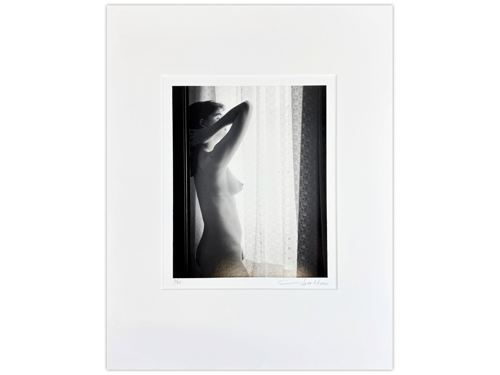 Jeff Nixon Signed Photo, "Nude Woman at Window": Jeff Nixon (American, 1952-2022). Limited edition unframed gelatin silver print, "Woman at the Window #3, Coral Gables, Florida". Pencil signed lower right under image and pencil numbered 3/35 lower l