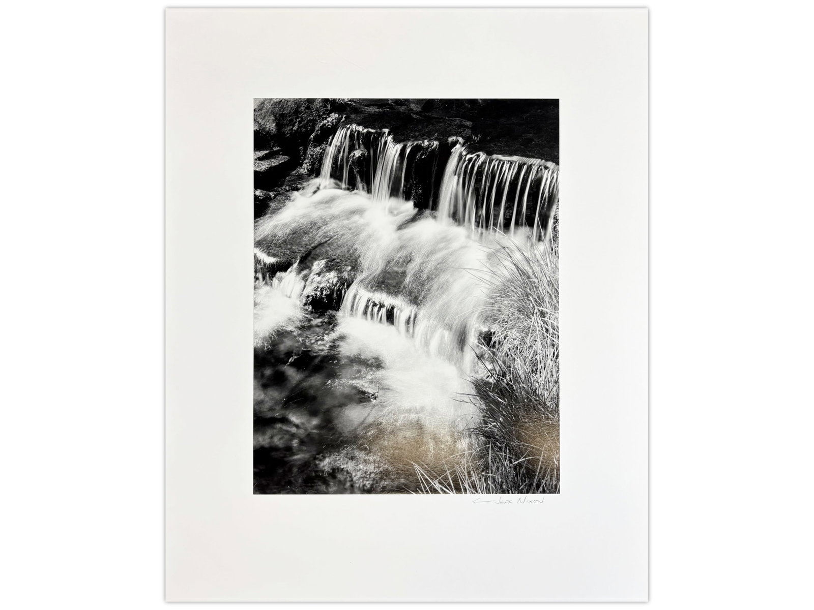 Jeff Nixon Signed Photo, "Fern Spring, Yosemite": Jeff Nixon (American, 1952-2022). Unframed gelatin silver print, "Fern Spring, Yosemite Valley". Pencil signed lower right under image. Sight seen approx. 10" x 13-1/4". Print is mounted to mat, and