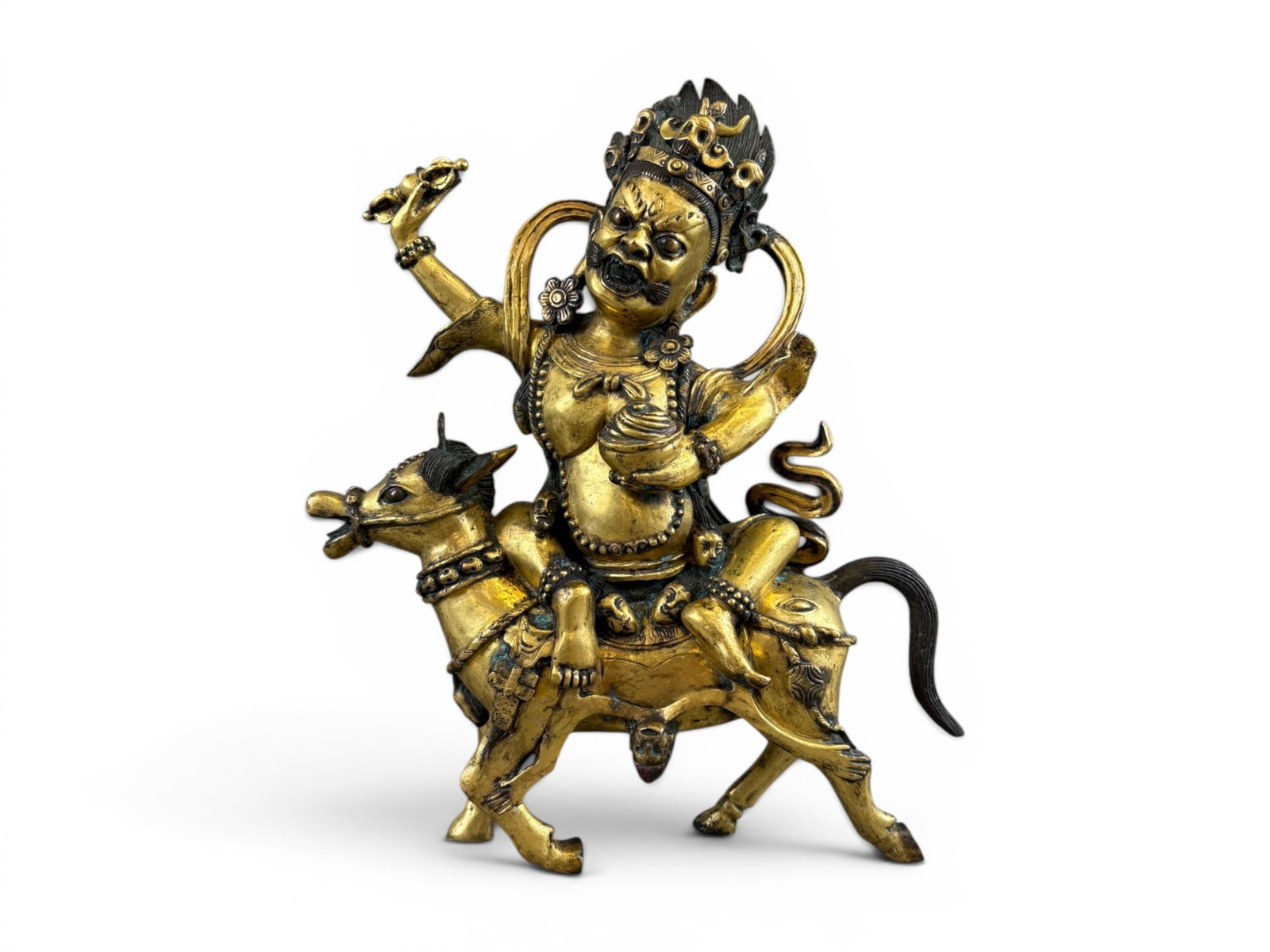 Tibetan Gilt Bronze Figure of Palden Lhamo: Tibetan gilt-bronze figure depicting the wrathful deity Palden Lhamo, adorned with elaborate crown, jewelry, and flowing scarf elements. Cast with detailed facial features and ornamental decoration th