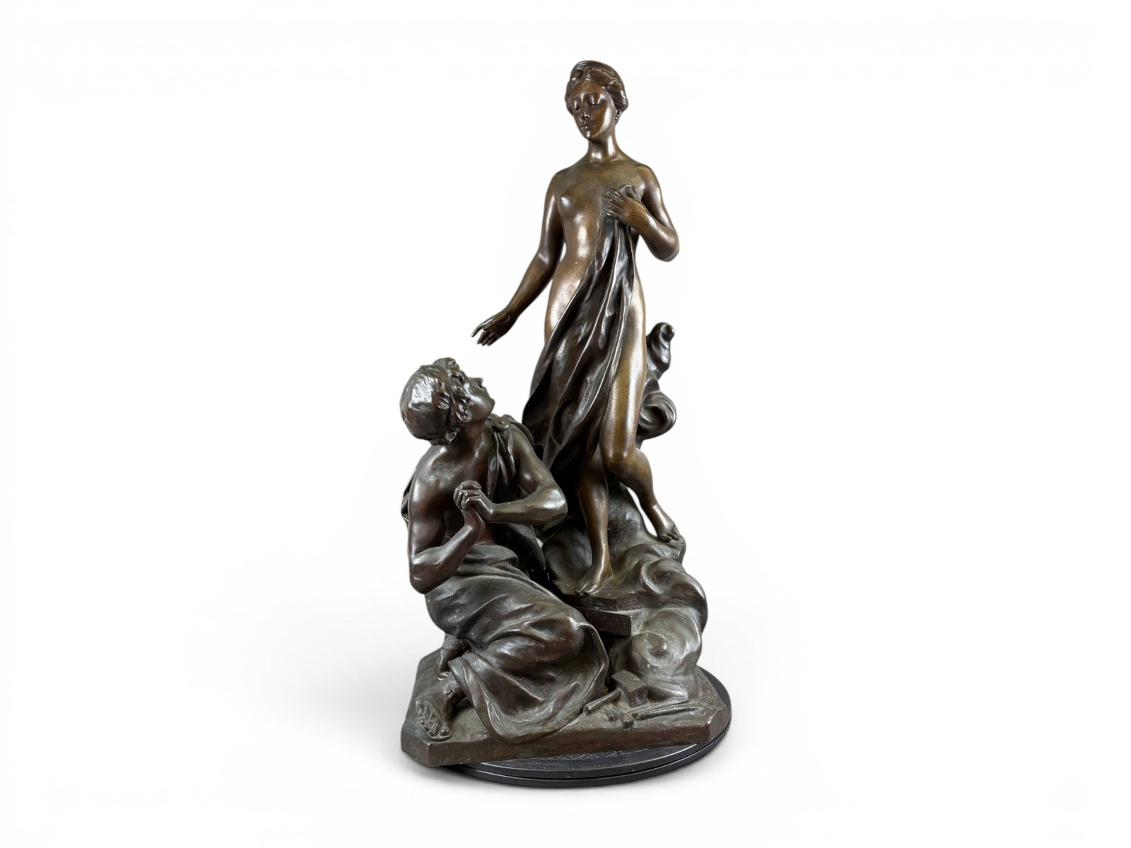 Henri Godet Bronze "Pygmalion & Galatea": Monumental bronze figural sculpture by Henri Godet (1863-1937) depicting the mythological subjects Pygmalion and Galatea in an emotional allegorical composition. The sculpture portrays a standing