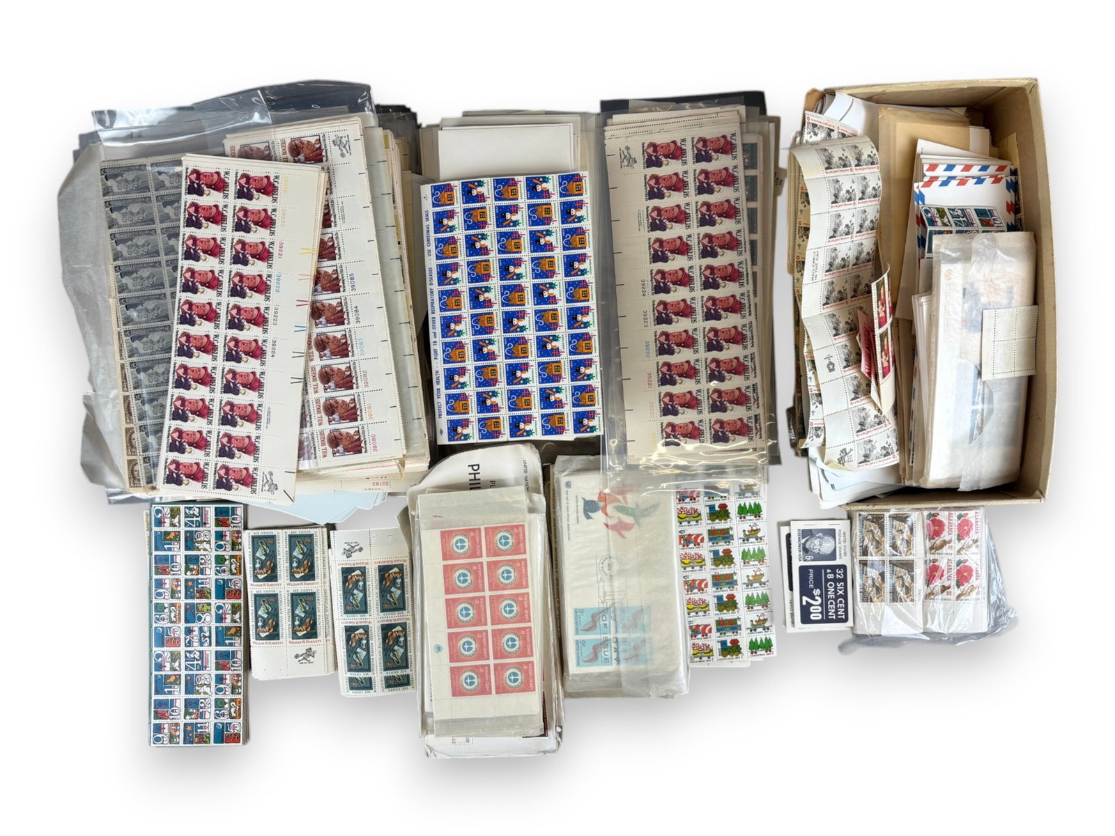 U.S. Face Value Lot: Box loaded with mint U.S. Postage of all denominations. Mostly Complete Sheets but also includes larger sized plate blocks and smaller higher denomination blocks. Face value easy in excess of $3000 no