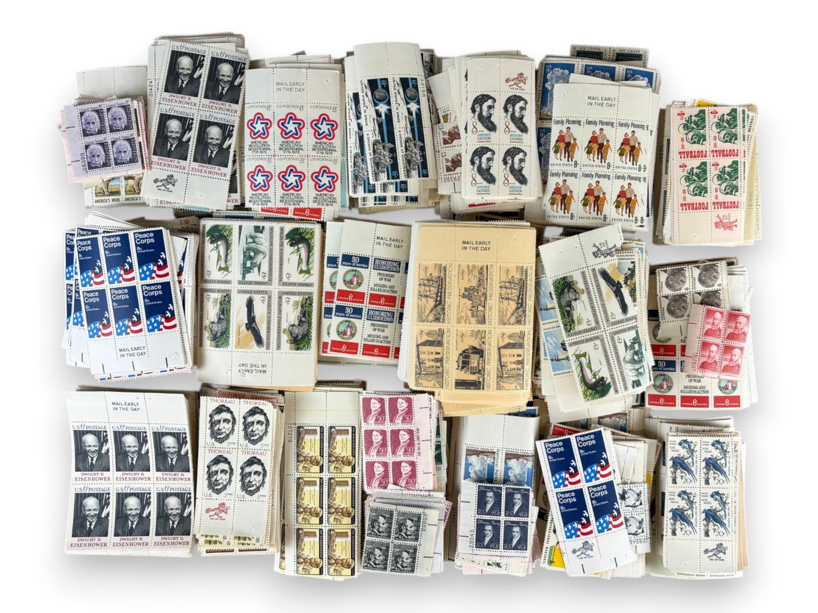 U.S. Face Value Plate Block Lot: United States mint face value accumulation consisting primarily of plate blocks in 6 cent, 8 cent, and 10 cent denominations, with some higher values and larger format blocks included. Includes values