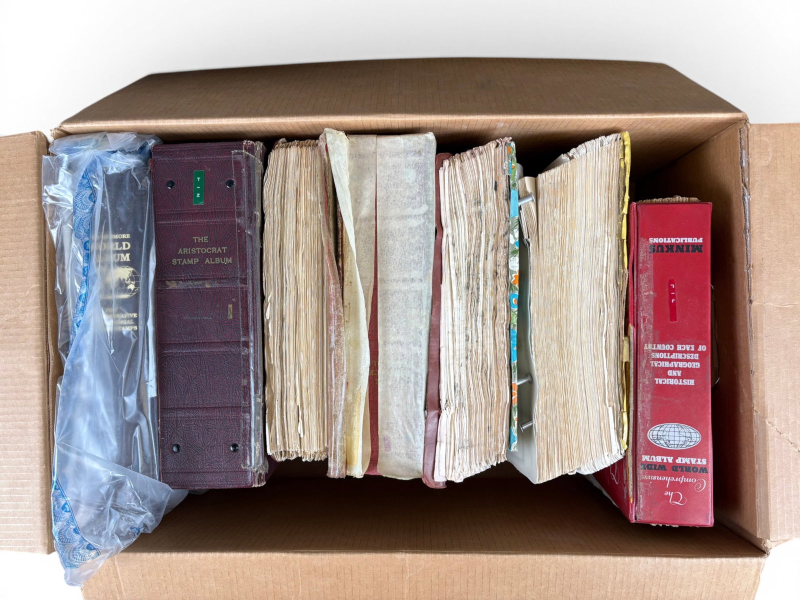 Estate Stamp Lot. World Wide: (4) Long Banker Boxes with Albums and Album Pages. Mostly scattered issues with some sets, mint and used plus stamps in new issue and other glassine envelopes. 1000's of stamps completely