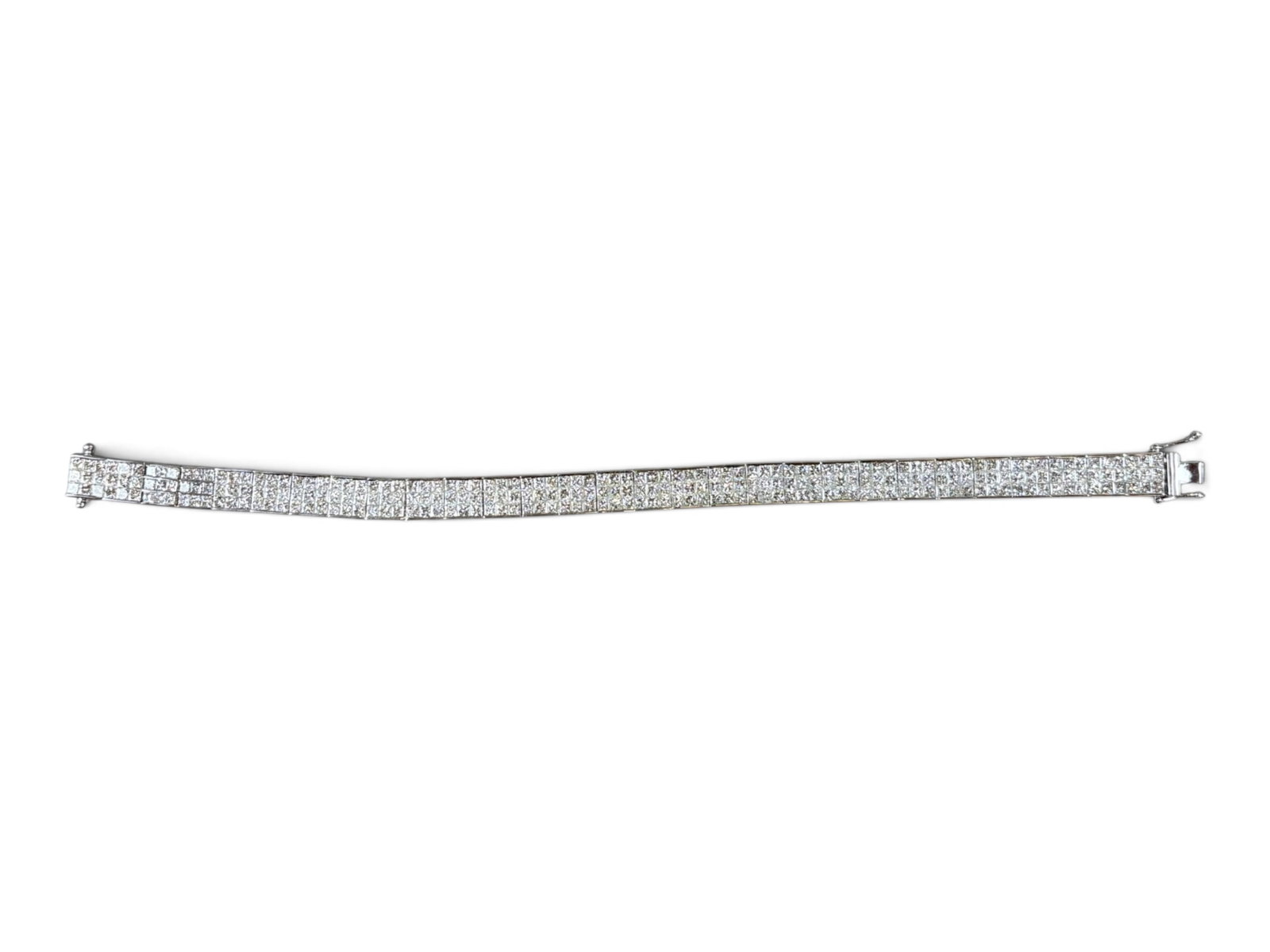 18kt White Gold Diamond Tennis Bracelet: 18kt white gold diamond ladies' tennis bracelet with 261 Princess cut natural diamonds invisible set. Diamonds total weight 14.15 ctw. Bracelet total 28.69 grams. Shipping: Weiss Auctions offers full-