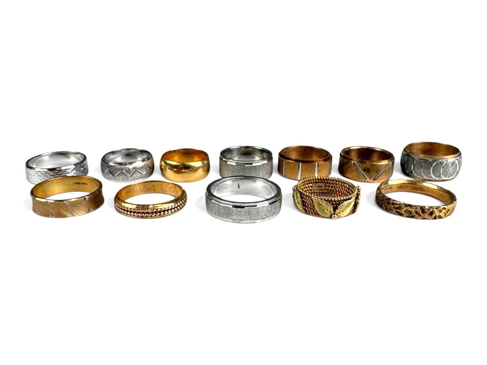 (12) 18K Gold Rings: (12) 18K gold rings in various designs and sizes. Total weight approximately 90 grams.This lot is being offered on behalf of the Kings County Public Administrators Office from the Estate of Michael Am