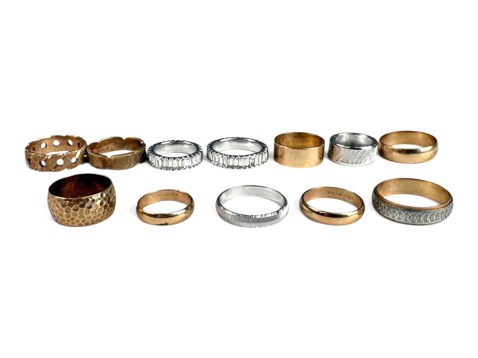 (12) Rings incl. (10) 14K Gold: (12) rings in various designs and sizes including (10) 14K gold rings with a total weight of approximately 49.8 grams and (2) white metal costume rings with colorless stones.This lot is being offered 