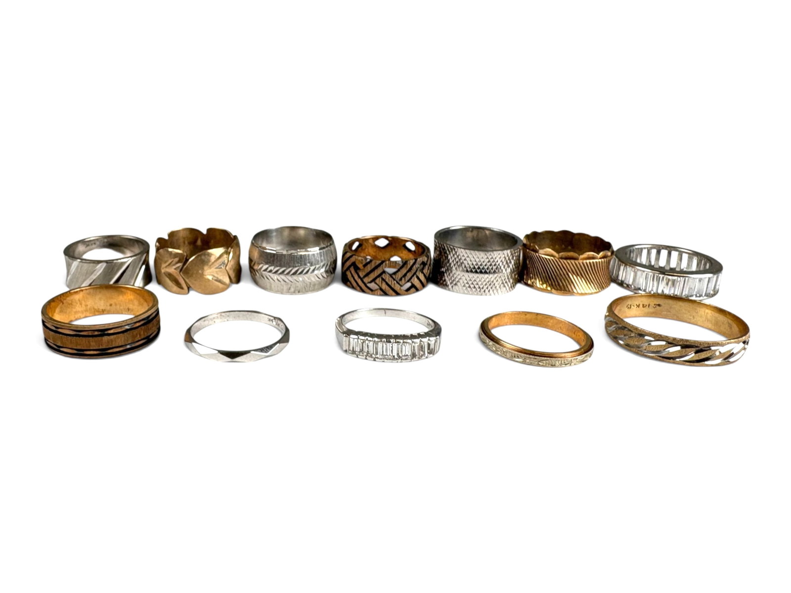 (12) 14K Gold Rings: (12) 14K gold rings in various designs and sizes, including (2) set with cubic zirconia. Total weight approximately 54.2 grams.This lot is being offered on behalf of the Kings County Public Administra
