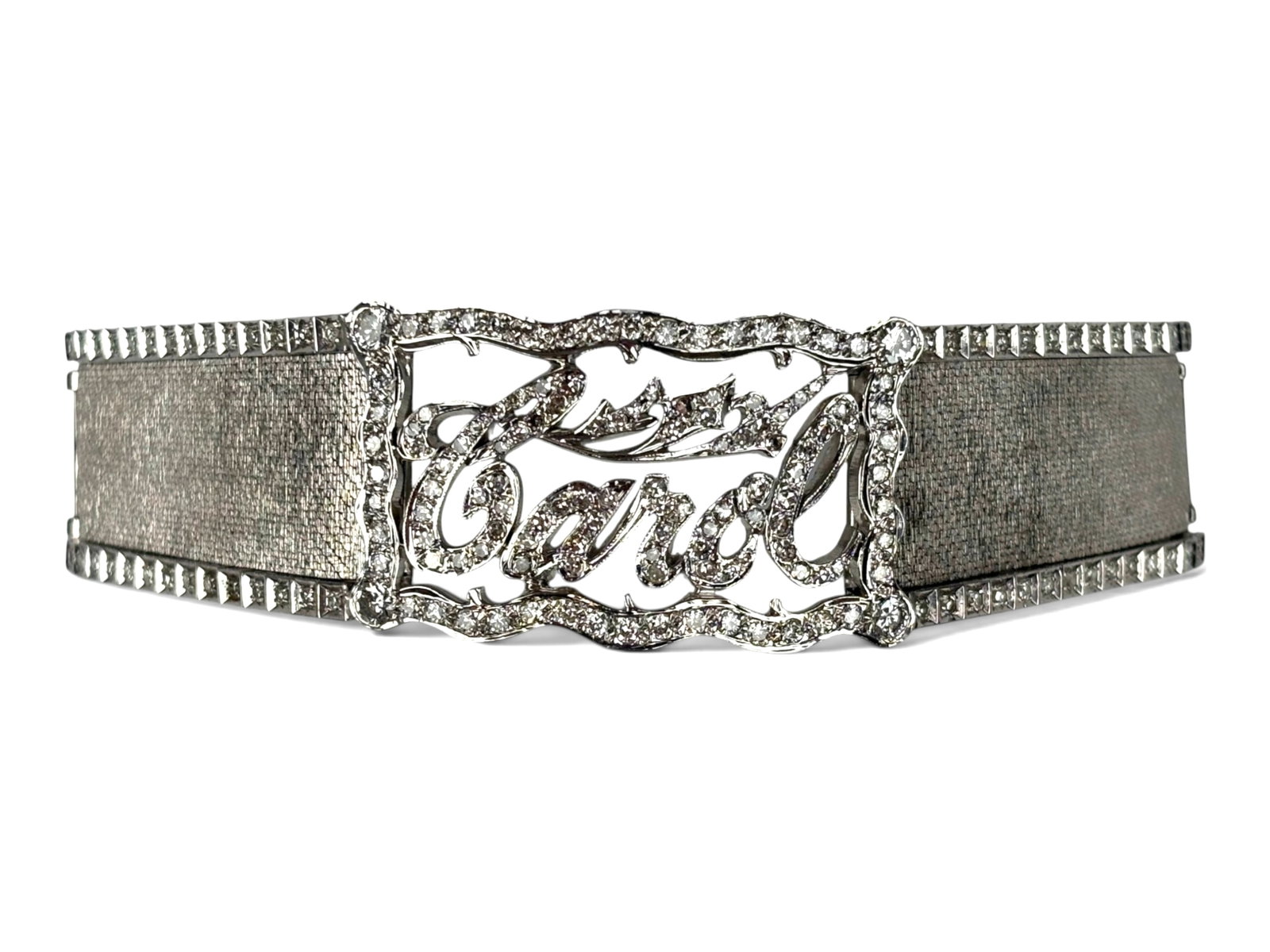 14K Gold Diamond "Carol" Bracelet: 14K white gold diamond bracelet spelling the name "Carol" in diamonds. Measures approximately 7 inches long by 28 mm wide. Total weight approximately 57.8 grams with an estimated total diamond weight