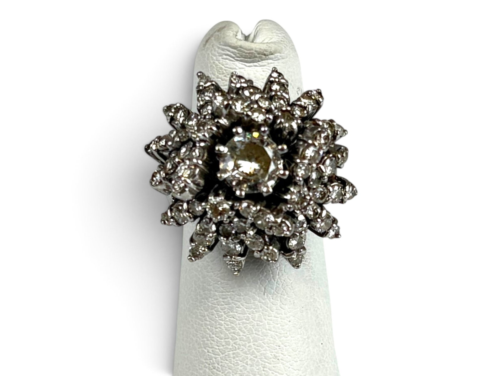 14K Gold Diamond Cluster Ring: 14K white gold natural diamond cluster ring, approximately U.S. size 4. Center round brilliant cut diamond estimated at approximately 0.72 ct, I color, SI1 clarity. Set with a total of (63) round