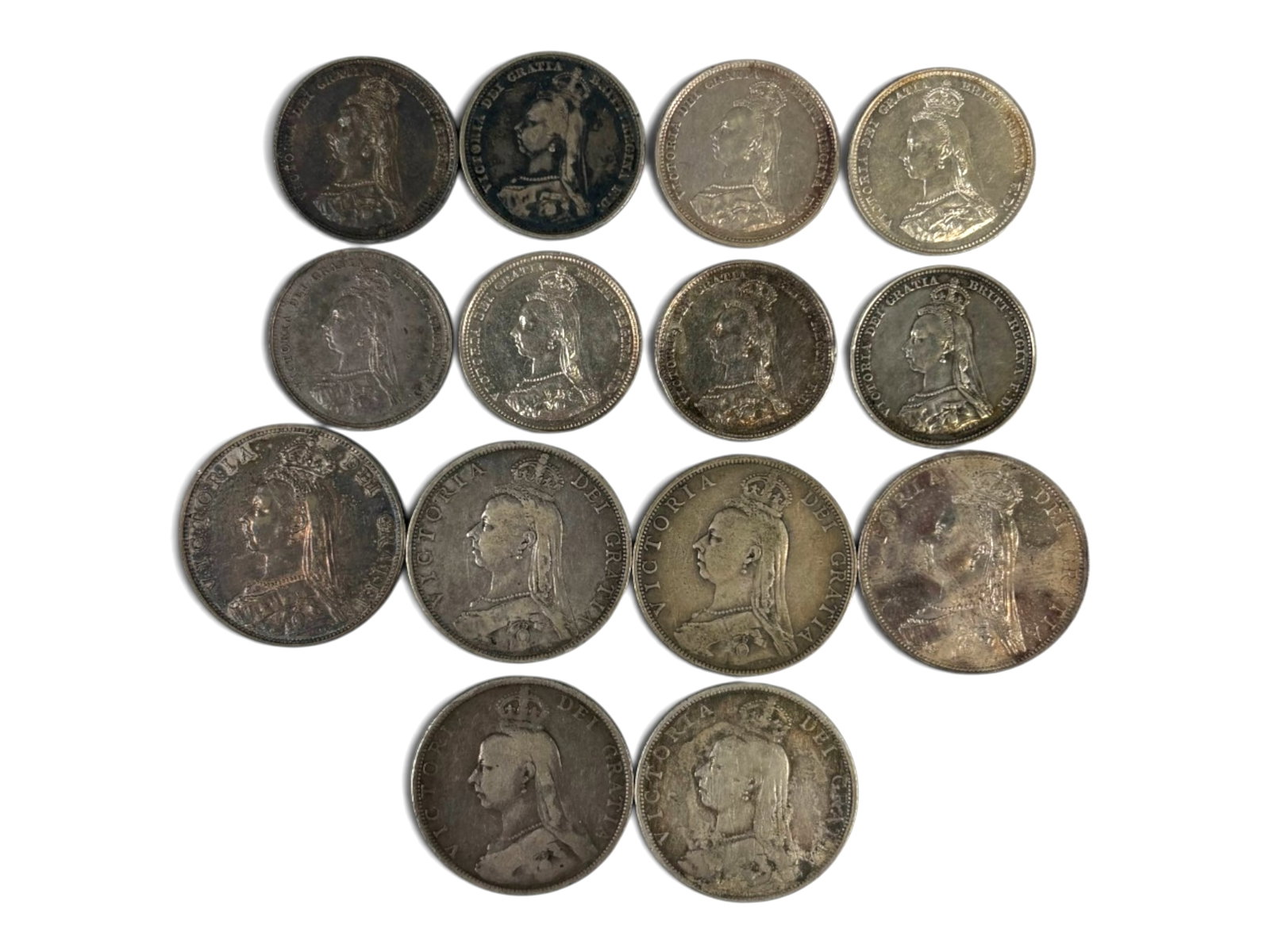 1888 Great Britain Florins & Shillings: Collection of 1888 Great Britain coins including (6) Florins and (8) Shillings. Ungraded. See images for condition. Shipping: Weiss Auctions offers full-service, in-house shipping for nearly all