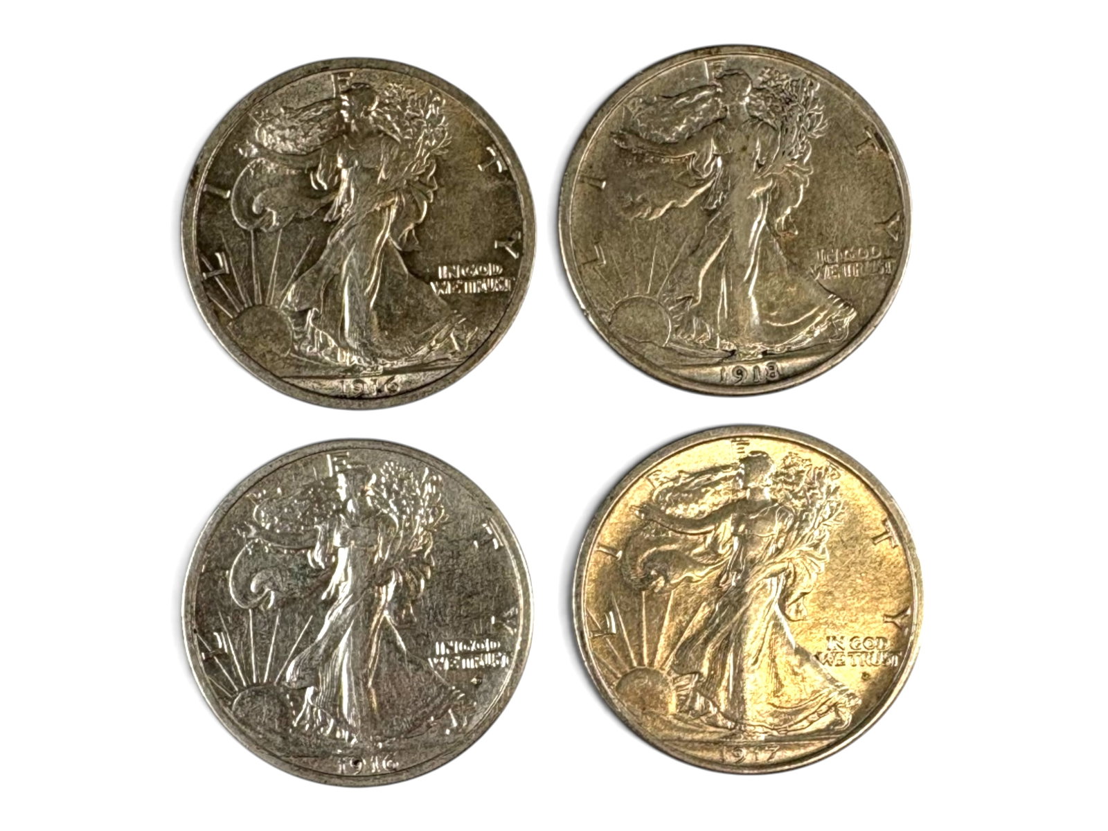 (4) Early Walking Liberty Halves: Group of (4) early date Walking Liberty half dollars including 1916, 1916-D, 1917-D Obverse Mint Mark, and 1918. Ungraded. See images for condition. Shipping: Weiss Auctions offers full-service, in-ho