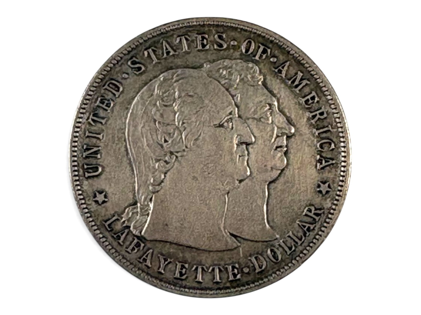 1900 Lafayette Commemorative Dollar: 1900 Lafayette commemorative silver dollar. Ungraded. See images for condition. Shipping: Weiss Auctions offers full-service, in-house shipping for nearly all items in this auction. For a shipping