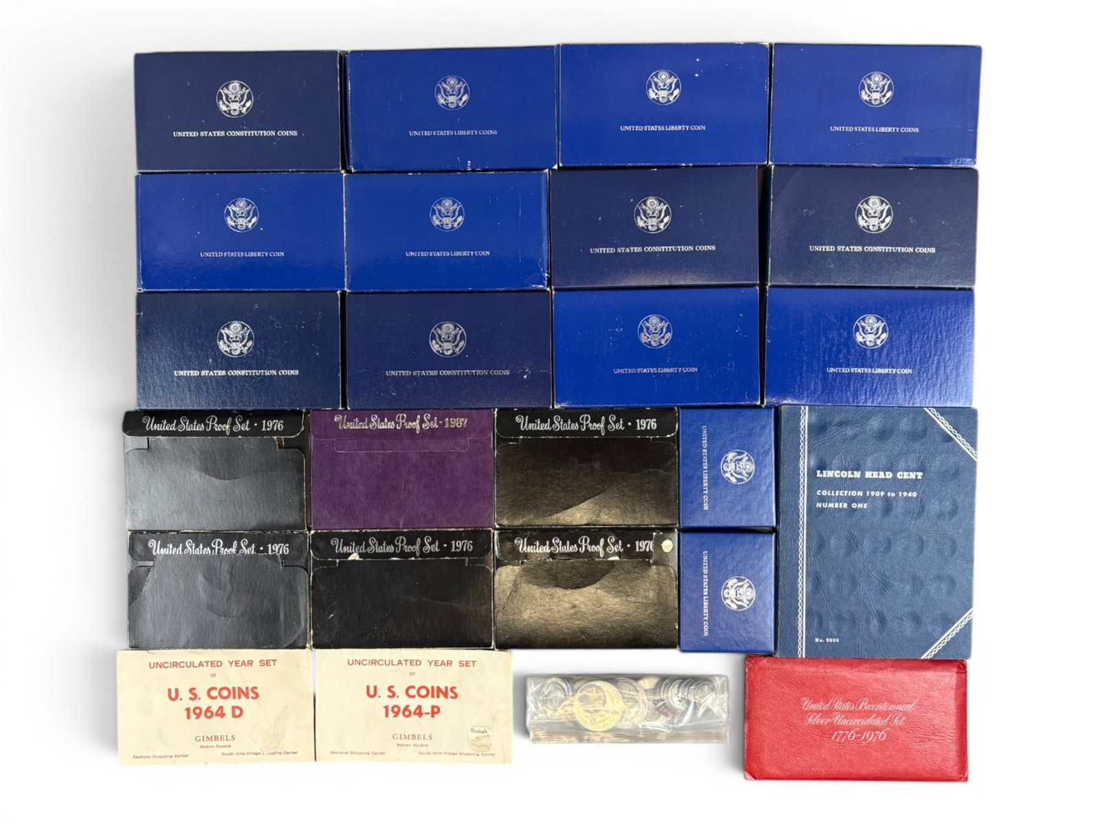 Estate Coin Collection: Estate coin collection including 6 Morgan Dollar and Peace Dollar coins, 11 modern commemorative dollars, a Bicentennial silver uncirculated set, 1964 uncirculated set, 6 assorted proof sets, Whitman