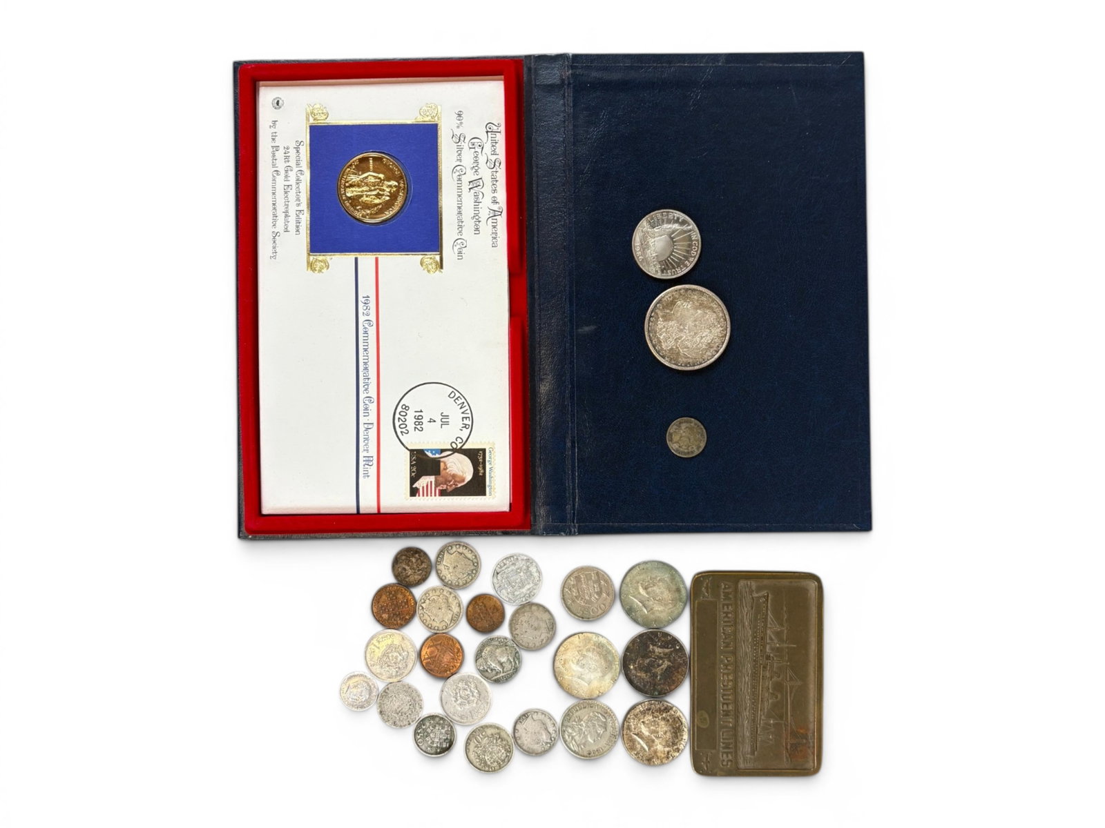 Estate Coin Collection: Estate coin collection including Morgan Dollar, Seated Liberty Dime, and Barber Dime examples, assorted American and foreign coins, and an American Lines paperweight. This lot is being offered on